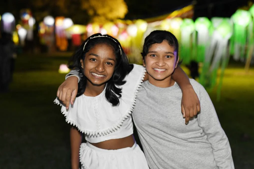 ALL SMILES: Dinara Piyasiri, 12, and Nethukee Jayasekera, 11, enjoy celebrating Vesak together. Wagga's Buddhist community united to light lanterns and commemorate one of the most significant days in their religious calendar. Wagga Sri Lankan Community Association and the Potowa Buddhist Group celebrated Vesak on Sunday. "Buddha was born on this day, he attained enlightenment on the same date and he passed away on the same date again,'