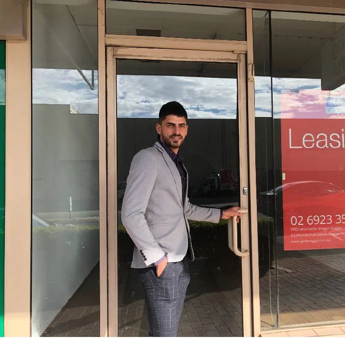 NEW BARBER: Khato Khato is hoping to gain Wagga City Council approval to convert a Forsyth Street shopfront to a barber shop. Picture: Jess Whitty A more affordable and new barber shop could soon be opening its doors in Central as a proposal has recently been submitted with Wagga City Council. Khato Khato arrived in Wagga two years ago and hopes to bring his flair and eye for design to men's heads by converting a shopfront, located on 56 Forsyth Street, into a barber shop. "I'm from Iraq and when I was younger I was interested in being a barber because I used to work with my uncle who had a barber shop in Iraq and I worked with him for one year," Mr Khato said. "When we left for Turkey I wasn't working as a barber, but then when someone was doing my hair I asked if they needed more help so I started with him and I've been a barber for about six years now. "This will be my first job in Australia, as I'm still at uni, so it will take a while to build customers but hoping I can expand the store for women as well in a few years." The 22-year-old said he hopes to open by the end of July and will initially be working on his own. "Other barbers in Wagga are a lot more expensive, but I'll be doing something a bit different by offering the 10th service for free," he said. "A lot of people in my community don't want to get a haircut by a barber as they can't speak English very well and struggle to tell the barber what style they want. "I go over to their home and do their hair and so they are waiting for me to open up my store."