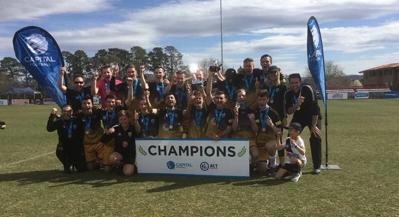 WAGGA City Wanderers have secured the first trophy in club history after their under-20 side came from behind to beat ANU 3-1 in the National Premier League ACT Two under-20s grand final in Canberra on Sunday. Down 1-0 at halftime to the runaway minor premiers, the Wanderers responded with three unanswered goals after the break to claim the premiership after finishing fourth at the end of the regular season. Jacob Ochieng found the equaliser in the 58th minute after following through a mistake from ANU's keeper, before Jake Ploenges put the visitors in front with a cracking finish eight minutes later. Soon after Zach Pinney finished off a beautiful cross from Grant Jenkins to seal the title."Being down 1-0 at halftime, it was a good reaction from the boys," under-20s coach Liam Dedini said. "The last few weeks we haven't been down so it was good to see them respond that way."We had to travel the last four weeks which takes its toll, and from fourth you're under pressure every week when it's do or die."We came out and proved a point today." Wagga City's under-17 girls were unlucky to lose their grand final to Canberra United Academy in a penalty shootout after scores were locked at 2-all after extra time.The under-18 boys will take on Woden-Weston in next week's grand final after an 85th minute goal from Fawaz Shani Baqi gave them a 1-0 preliminary final win over Monaro Panthers on Sunday.