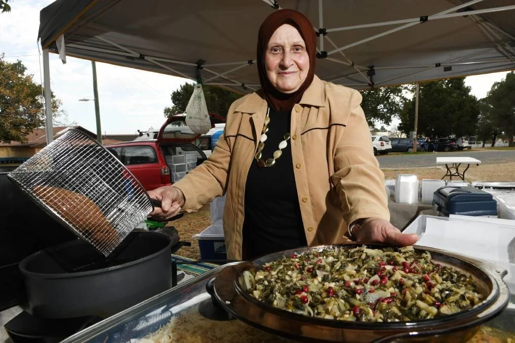 Baklava, falafel and hummus are just a few traditional recipes one Syrian woman loves to whip up for sale at the Wagga markets. It's almost that time of year where residents and visitors can eat as many dishes from around the world to their heart's content. In the spirit of the upcoming Fusion Festival, The Daily Advertiser will be profiling some of the delicious cuisines that can be found in this city, and the people who can cook them with their eyes closed.Myriam Yamak takes pride in her cooking and loves being able to showcase her culture's food. "I came from Syria to here in 2012," she said. "My daughter was having a baby, and she could not come back, and after the war in Syria, I could not come back. "I love Wagga. I love the people here, they are very nice and gentle. "Baklava, falafel and hummus, za'atar, zucchini omelette, spinach based dishes, yabraq (stuffed grape leaves) and spiced fish are just a few of the recipes that Ms Yamak whips up. "It makes me happy to cook," she said. "I remember my family and I love to give people here what my family eat." Ms Yamak added it was important for her to be able to share her culture in Wagga and ensure the cooking practices she knows are put to good use. Belinda Crain, CEO of the Multicultural Council, said Ms Yamak is just one of the community members who they have helped to set up a business at the Riverina Producers' Market that runs every Thursday at the Wagga Showgrounds. "We have been working with to support their food stalls at many other occasions," she said.Fusion19 is on Saturday October 19 at the Victory Memorial Gardens from 4pm.
