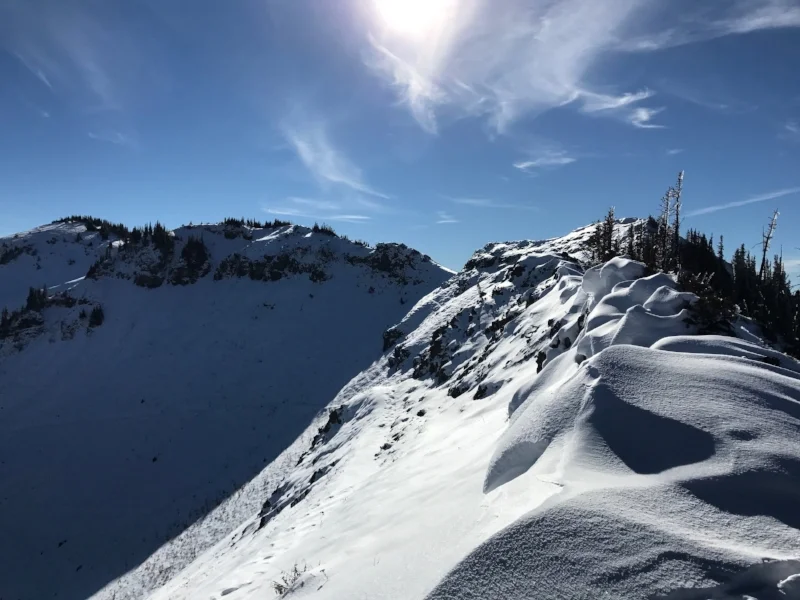 A snow and ice covered ridge line.