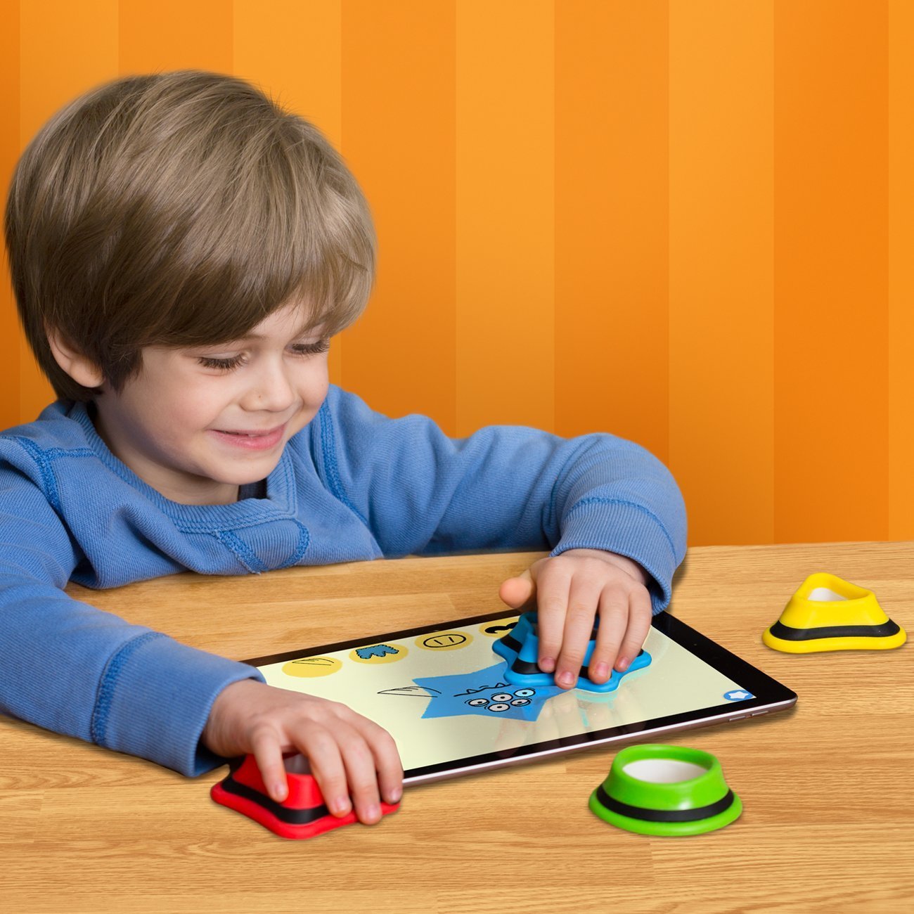 Boy playing with Kidtellect Tiggly Shapes.jpg