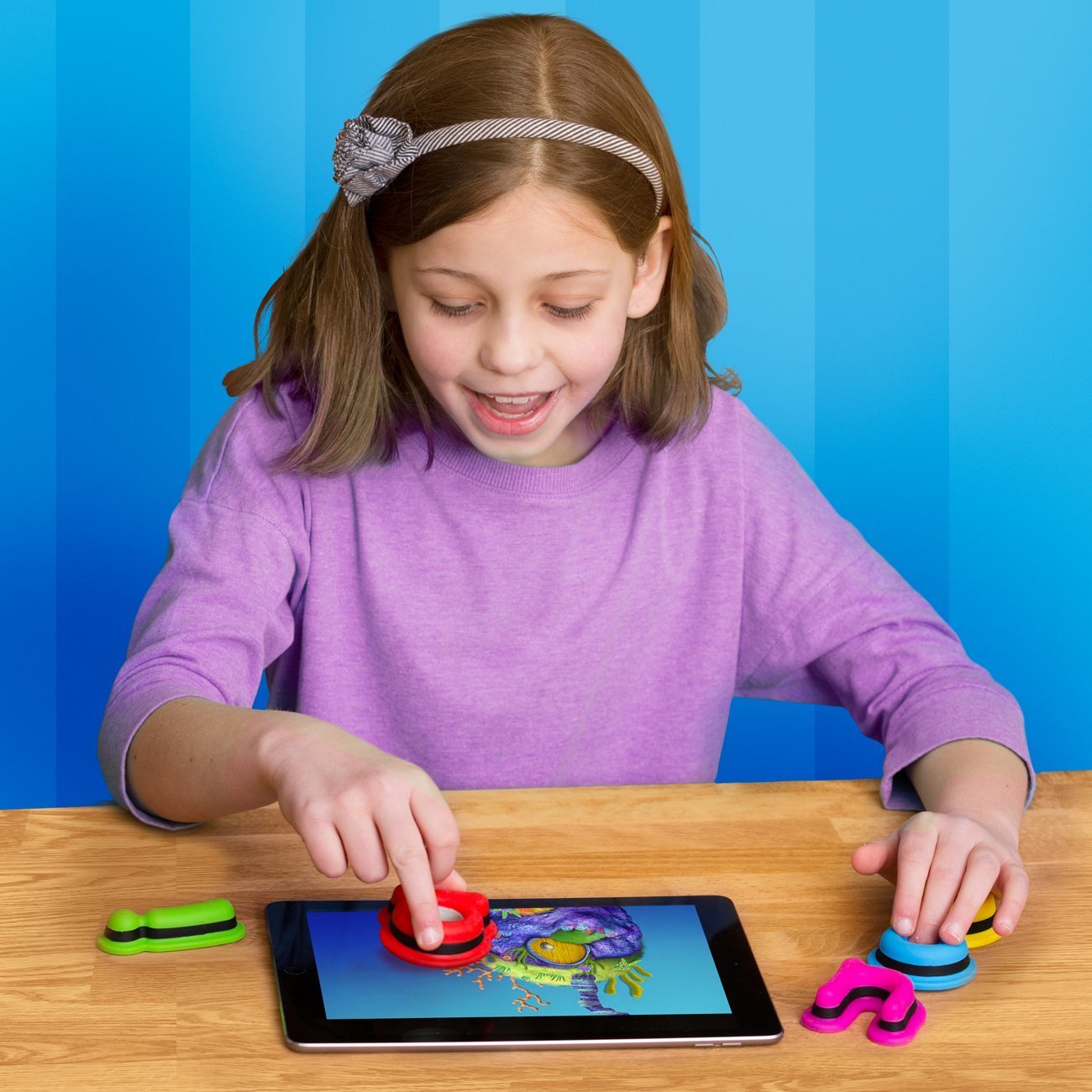 Girl playing with Kidtellect Tiggly Shapes.jpg