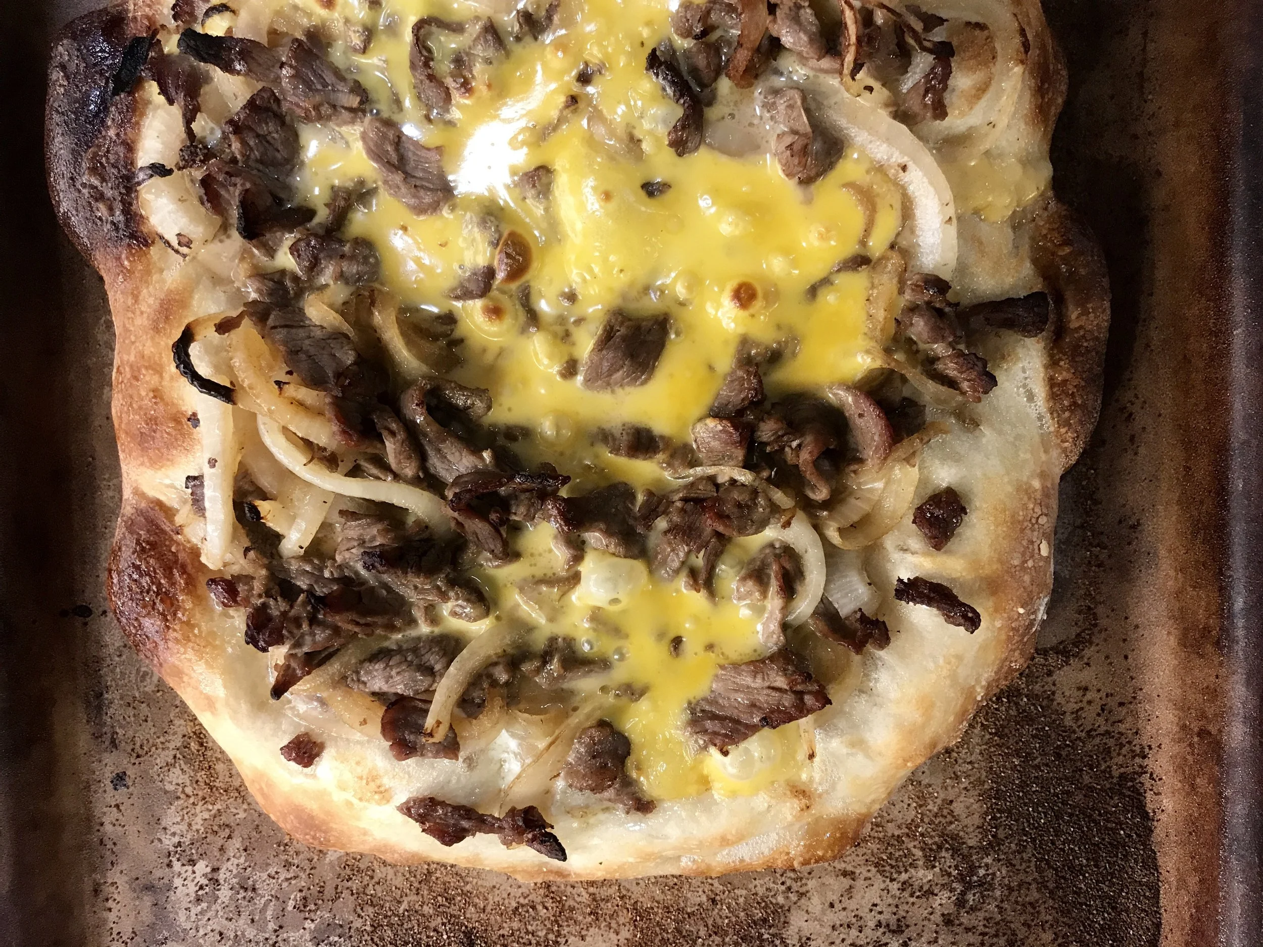 Dueling Cheesesteak Pizzas