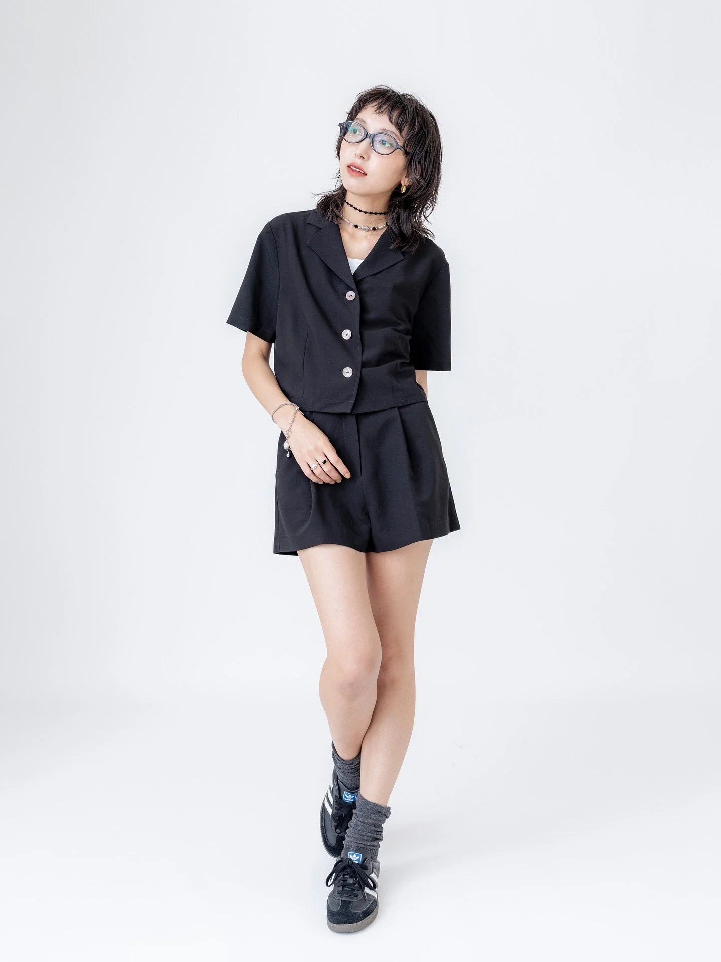 Some simple, classic pieces in black, white and beige. We have especially picked easy-care but breathable fabrics to accommodate city life. Featured here in black our rayon/tencel blend set, linen-cotton shorts, sheer tencel chiffon shirt and draped 