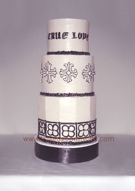 MJ and Beth's cake design included gothic lettering and Baltic crosses to match their rings.