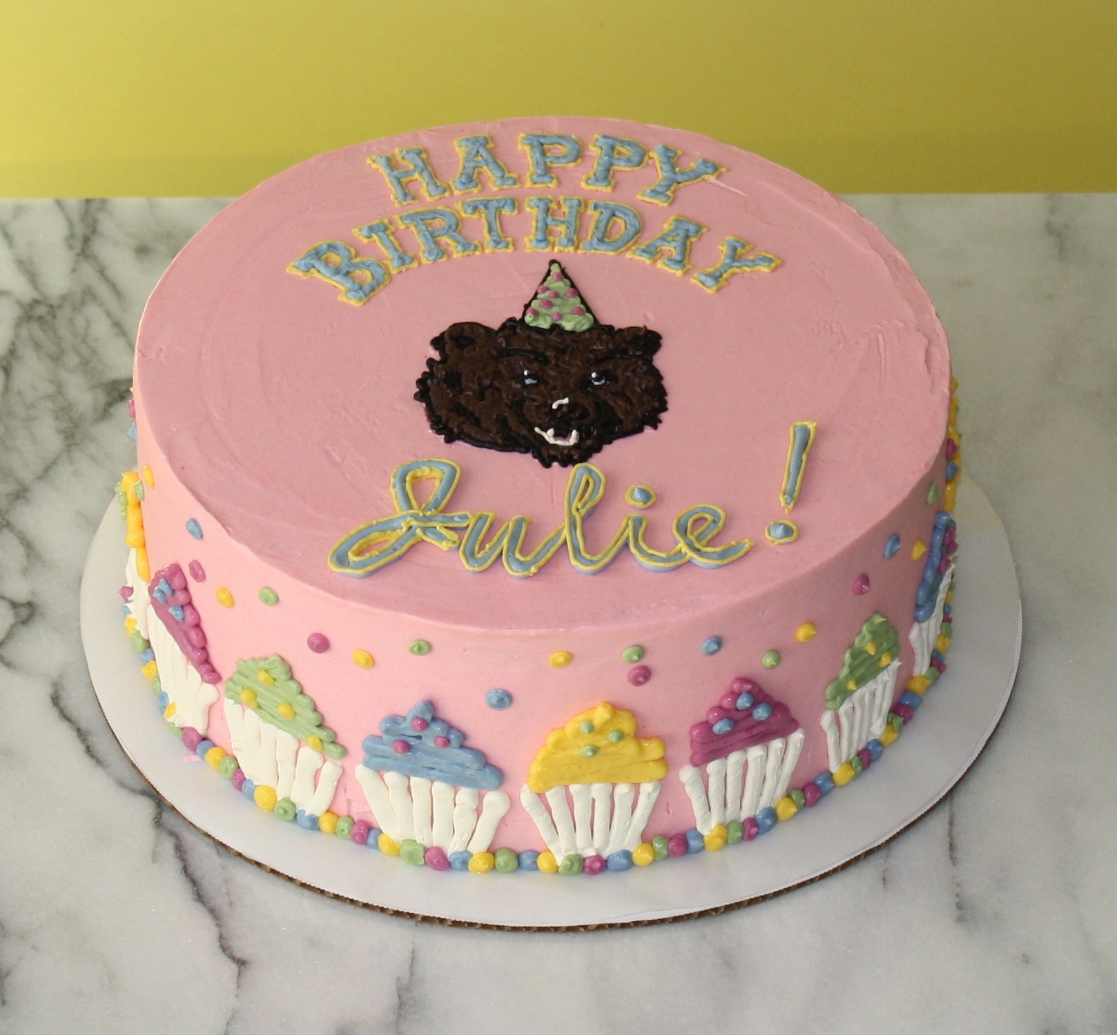 Julie loved her alma mater, UCLA, and cupcakes. So what better pairing for a cake than Joe the Bear in a party hat surrounded by cupcakes?