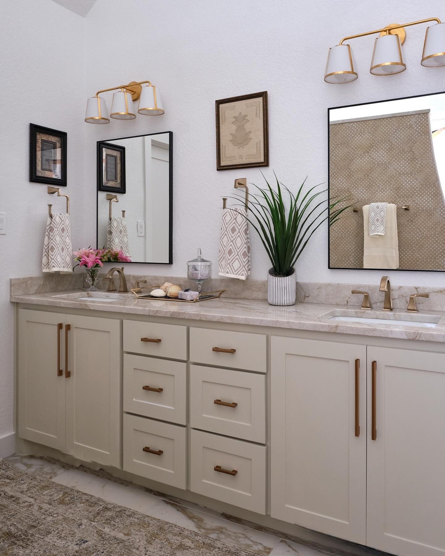 We love creating primary bathrooms that have a mood about them. This bathroom was totally transformed by removing the old and dated tub and adding a walk in shower. No glass but a curved wall to soften all the cold edges a bathroom always has. The he