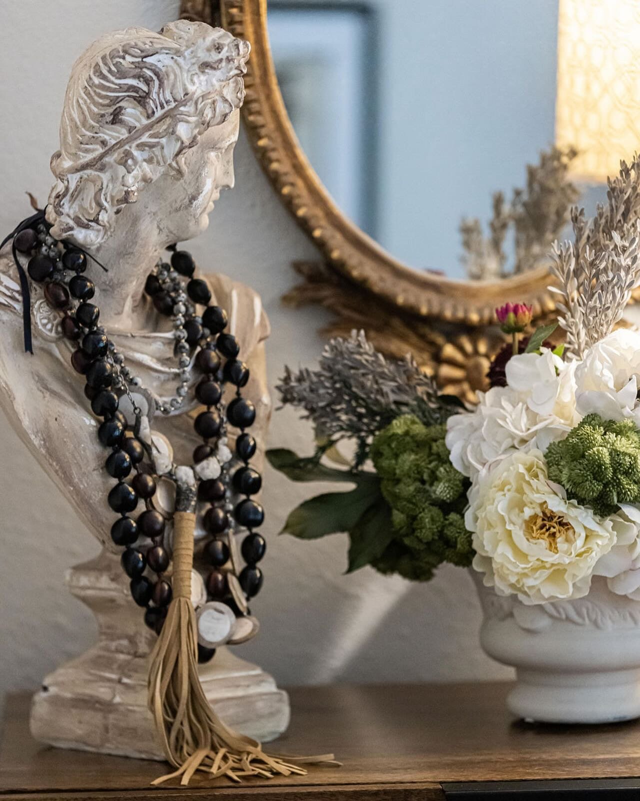 Using bust sculptures as a necklace holder is a great way to display those items you love and want to enjoy on a daily basis! #decoratingwithbusts #sculptures #decorating #interiordesign #dallasdesigner #ruthiestaalseninteriors #homedecorideas #bustd