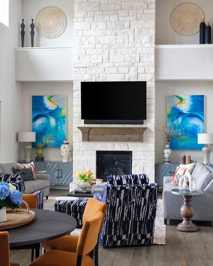 We love to add colorful art to the homes we design. This blue abstract artwork was one of the first things we chose for this client, we had it commissioned by a local artist. We selected items for the space with the art being our inspiration. Notice 