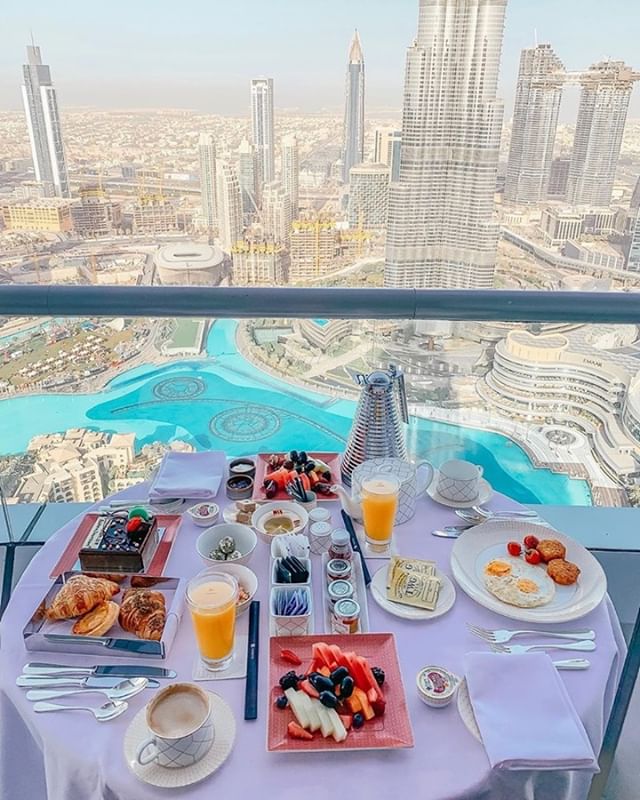 Breakfast with an amazing view In Dubai.  A bit about Dubai: Dubai is a city and emirate in the United Arab Emirates known for luxury shopping, ultramodern architecture and a lively nightlife scene. Burj Khalifa, an 830m-tall tower, dominates the sky