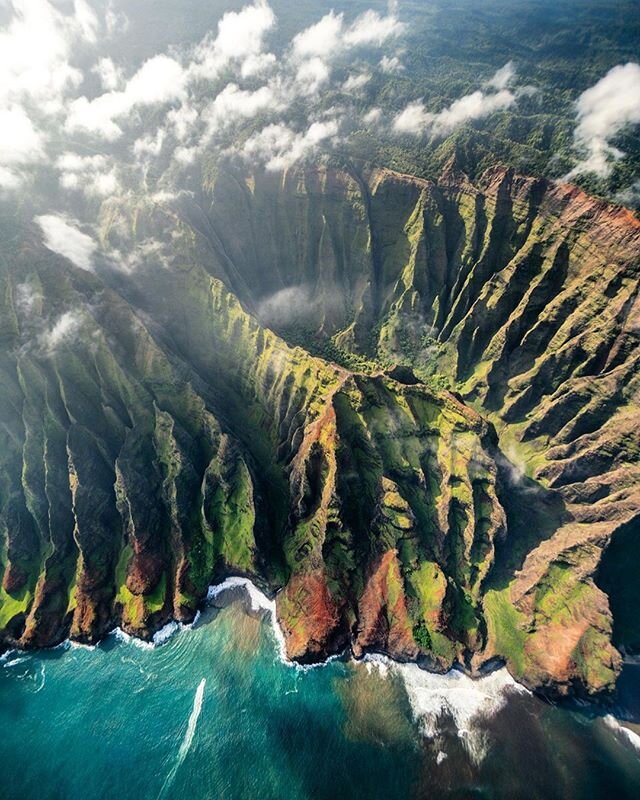 Nāpali Coast State Wilderness Park lies in the northwest of Kauai Island, Hawaii. It&rsquo;s known for its towering pali, or sea cliffs, punctuated by narrow valleys, streams and cascading waterfalls. The Kalalau Trail is a steep footpath running thr