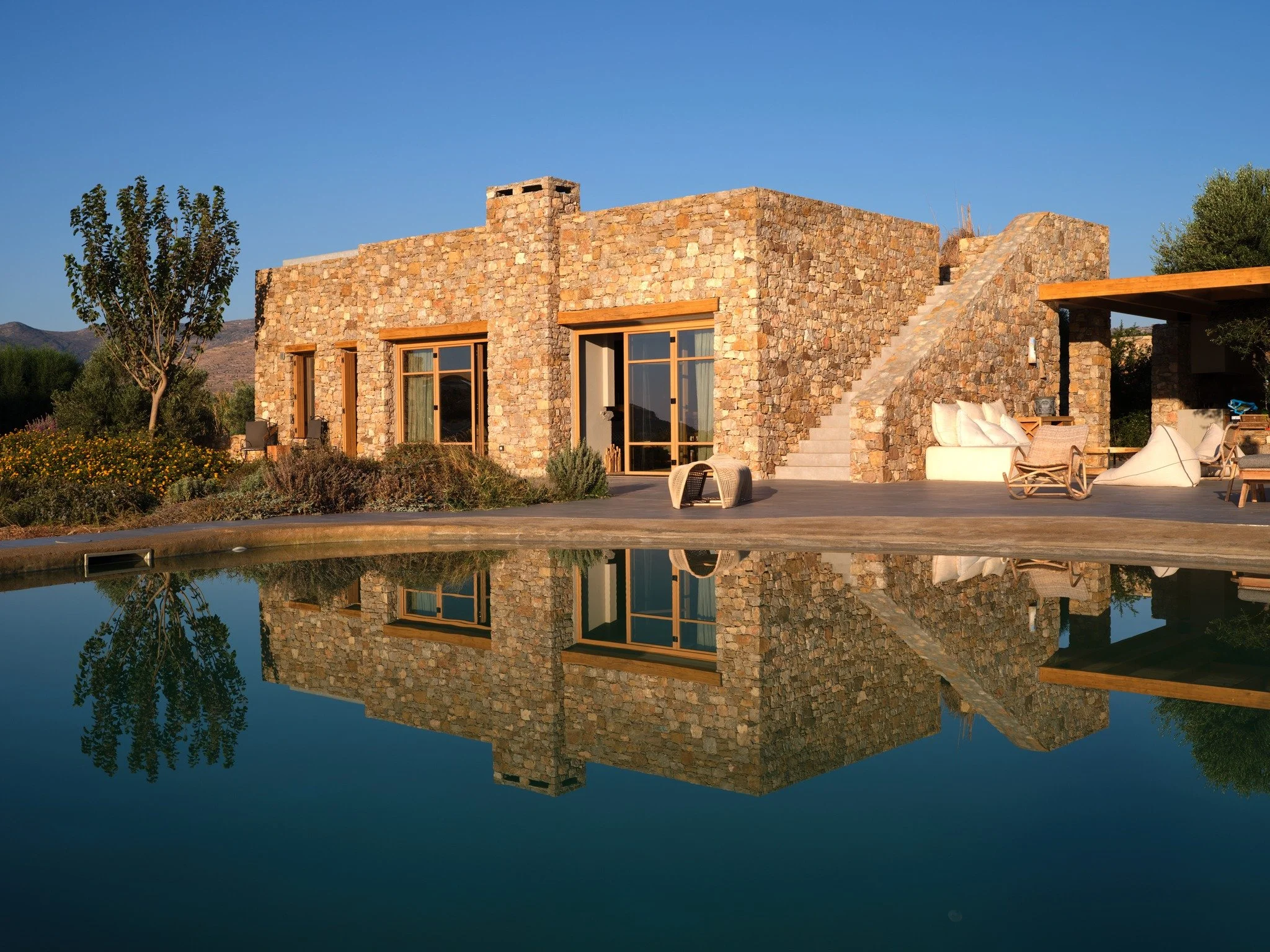 Surrounded by elegant landscape, seclusion and tranquillity are the assets here. While the interior of the villa  delights with its combination of rustic and luxury touches, it's in its outdoor spaces that the property really comes into its own. Love