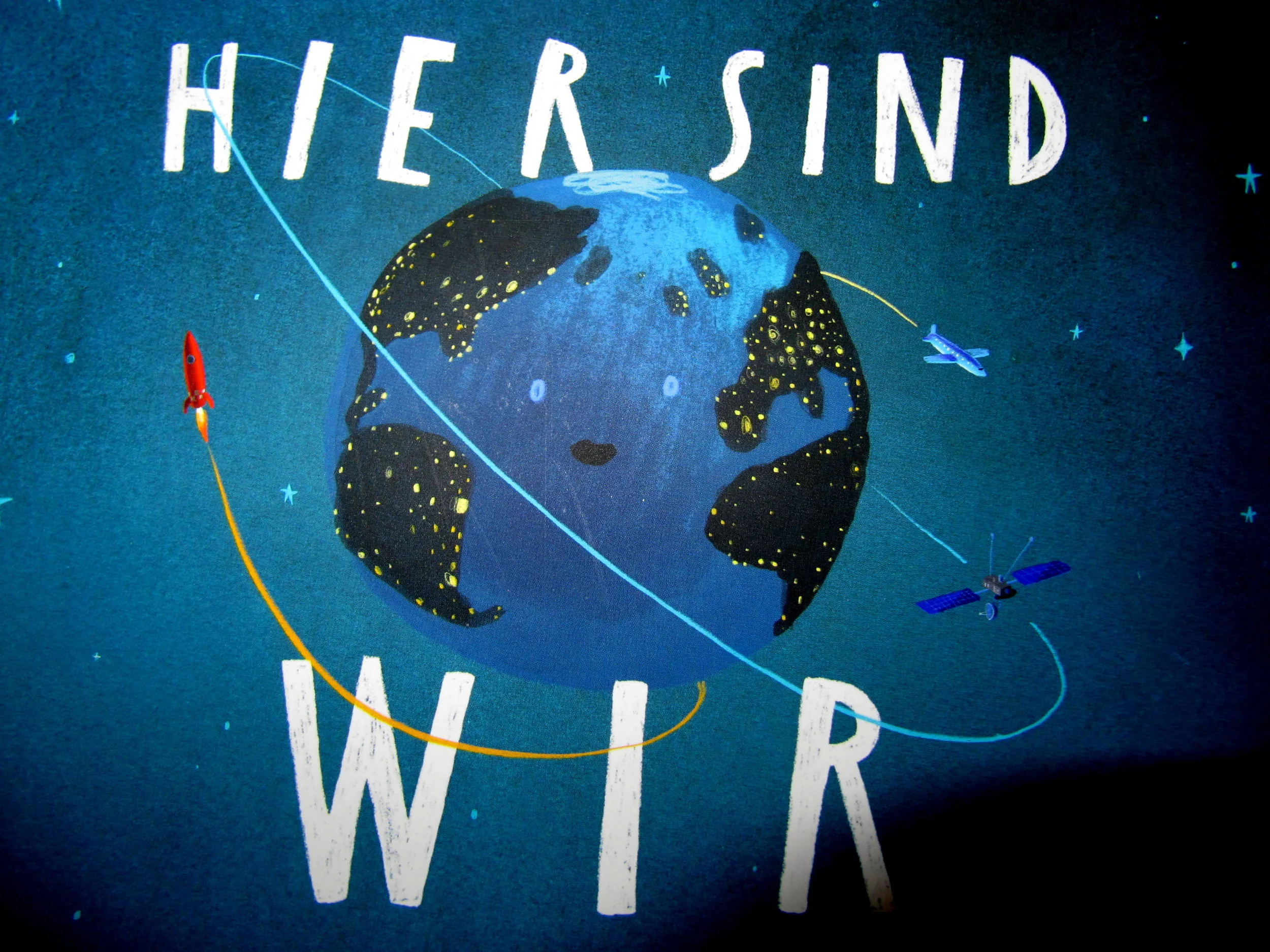 Hier sind wir -  Anleitung zum Leben auf der Erde