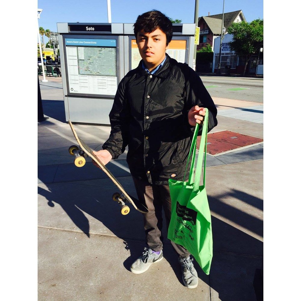 Jonathan riding his skateboard and taking the Gold Line on his way to school!