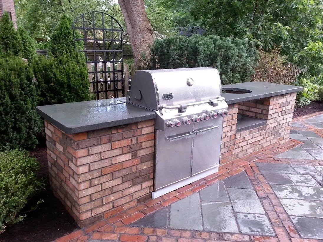 Outdoor Kitchen vs Grill Island: Advice From Landscaping Companies for Making the Choice for Your Highland Park, IL Area Backyard
