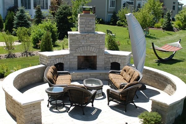 Custom outdoor fireplaces in Kildeer, IL, designed alongside paver patios and landscape lighting.