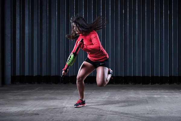 Woman using functional equipment while working out in a studio