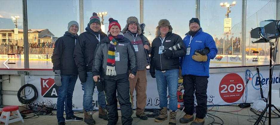 Minnesota Hockey crew left to right: Declan Goff, Brian Halverson, Scott Tiffany, Johnny Watkins, Jeff Wegge, and Tim Kolehmainen. Missing is Bill Rossini.