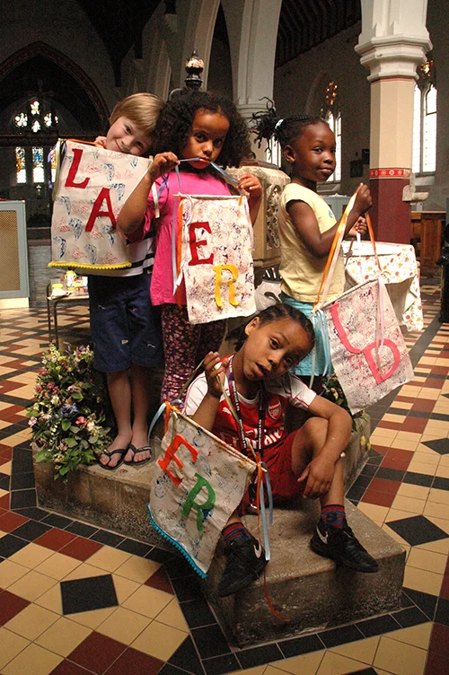 Wall hangings printed using stencils and woodblocks at the Morris & Friends arts and crafts workshop for children.