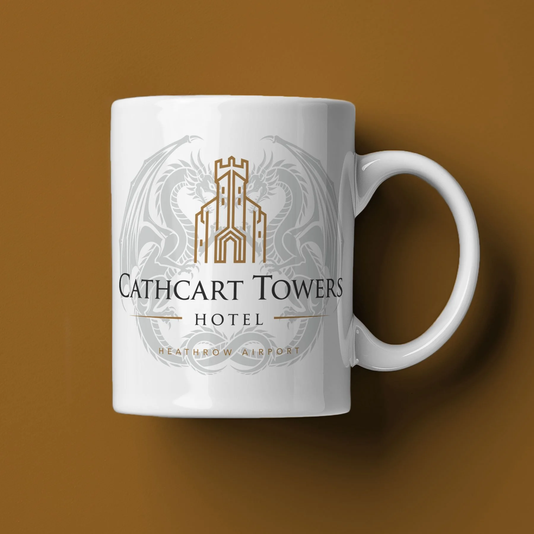 A Cathcart Towers Hotel Mug lies on its side against a bronze background.
