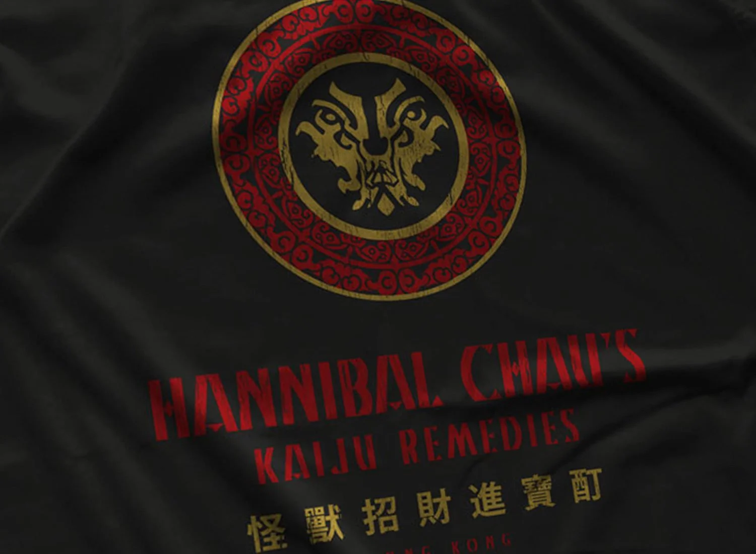 Close-up of a Hannibal Chau's Kaiju Remedies T-Shirt in Black. Get your "Pacific Rim"-inspired shirt in sizes S to 5XL, starting at just $21.49 with free shipping.