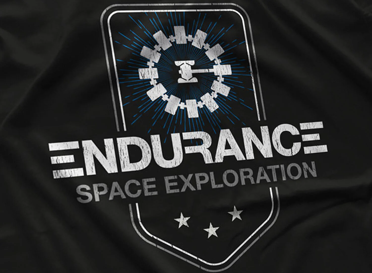 Close-up of a Endurance Long Sleeve T-shirt in Black. Get your "Interstellar"-inspired shirt in sizes S to 5XL, starting at just $27.99 with free shipping.