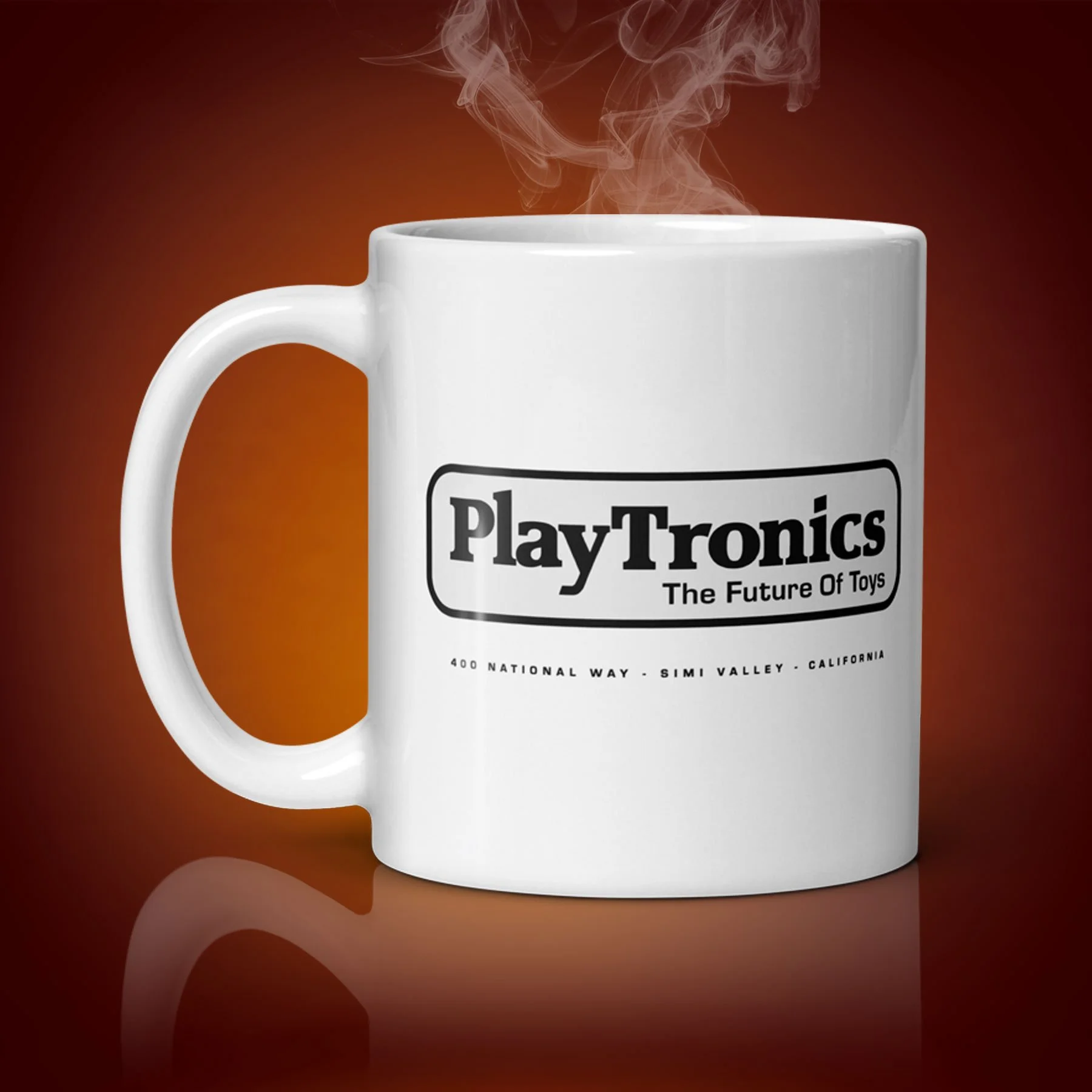 An 11-oz PlayTronics mug displays the right side. The artwork on our mug is inspired by the movie "Sneakers". It is available for $21.99 with free shipping.
