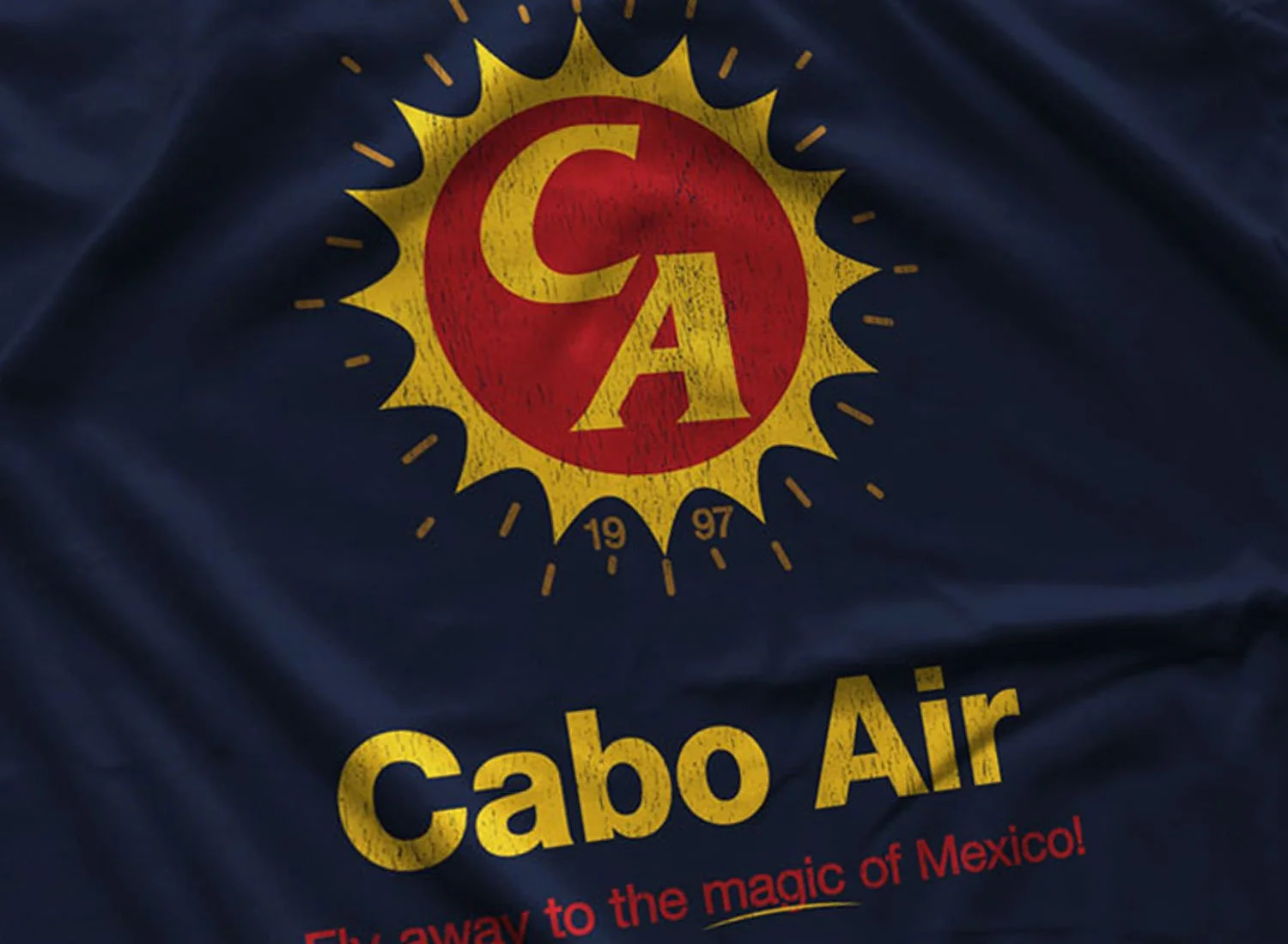 Close-up of a Cabo Air T-Shirt in Navy Blue. Get your "Jackie Brown"- inspired shirt in sizes S to 5XL, starting at just $21.49 with free shipping.