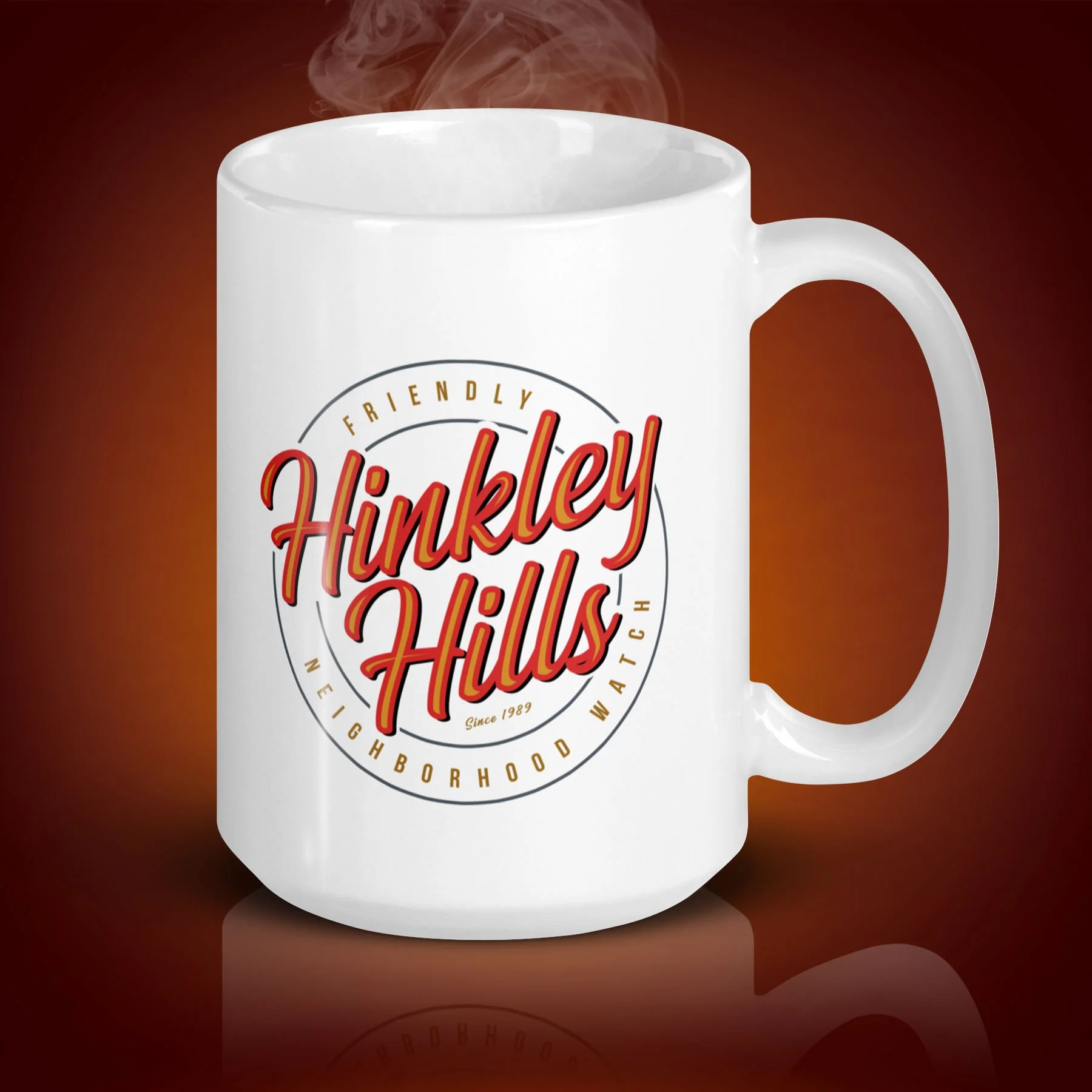 An 15-oz Hinkley Hills mug displays the left side. The artwork on our mug is inspired by the movie "The 'Burbs". It is available for $24.49 with free shipping.