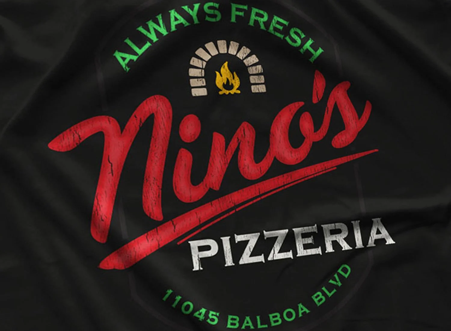 Close-up of a Nino's Pizzeria T-Shirt in Black. Get your "Drive"- inspired shirt in sizes S to 5XL, starting at just $21.49 with free shipping.
