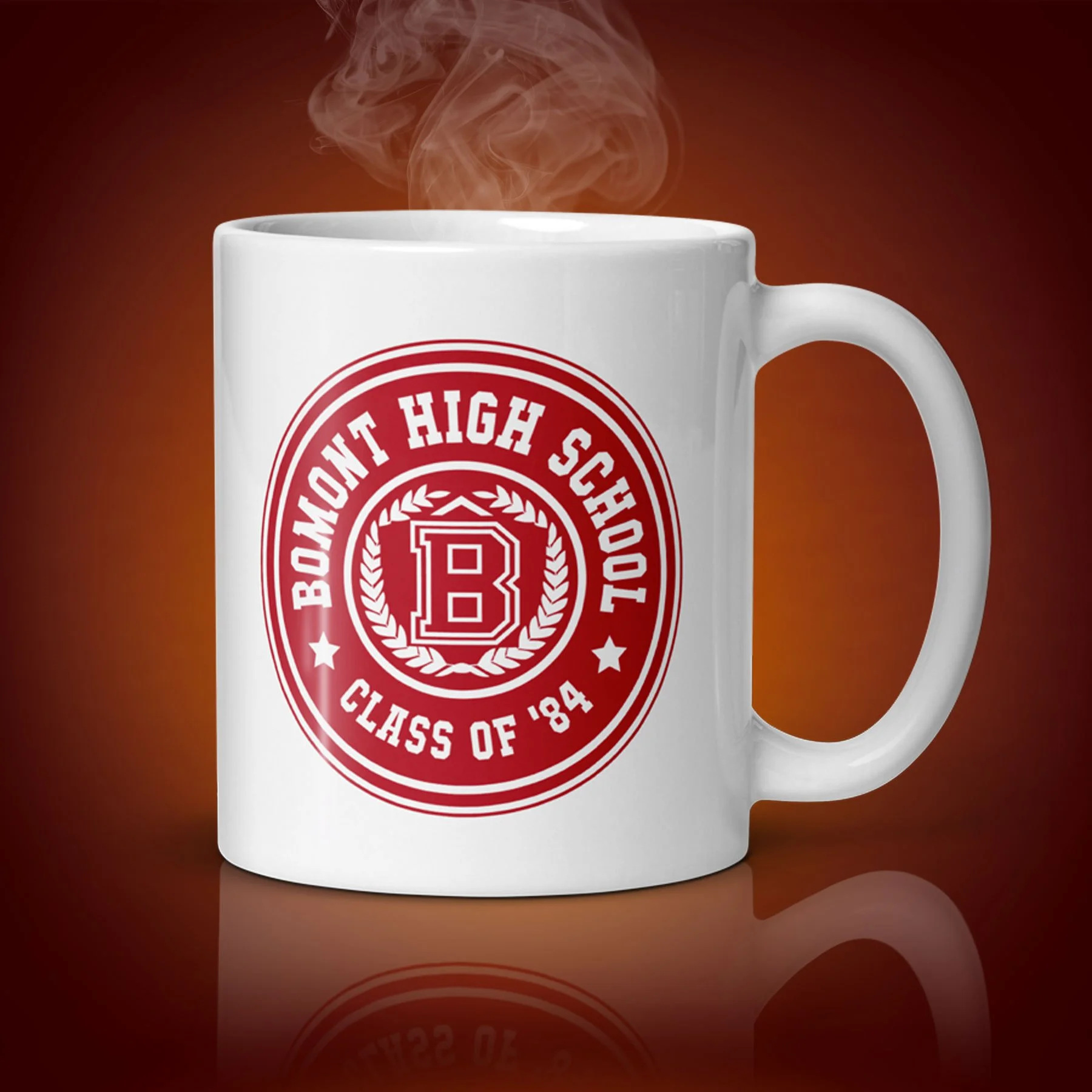 An 11-oz Bomont High School Mug displays the left side. The artwork on our mug is inspired by the movie "Footloose". It is available for $21.99 with free shipping.