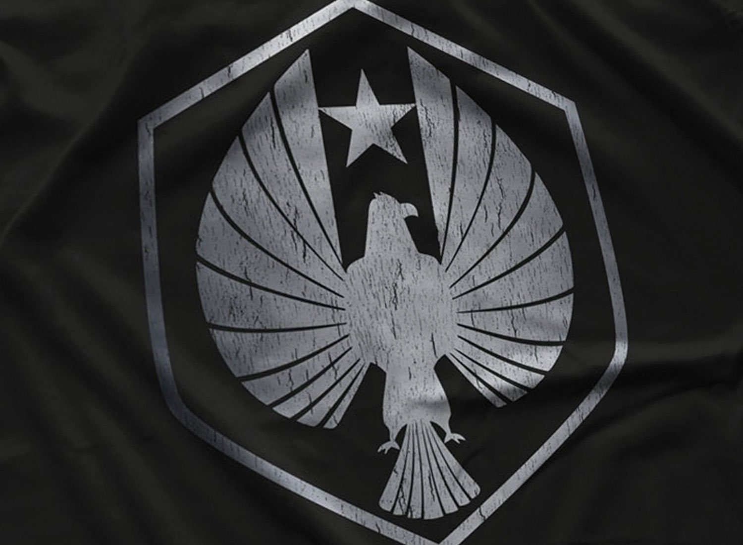 Close-up of a Pan Pacific Defense Corps T-Shirt in Black. Get your "Pacific Rim"-inspired shirt in sizes S to 5XL, starting at just $21.49 with free shipping.