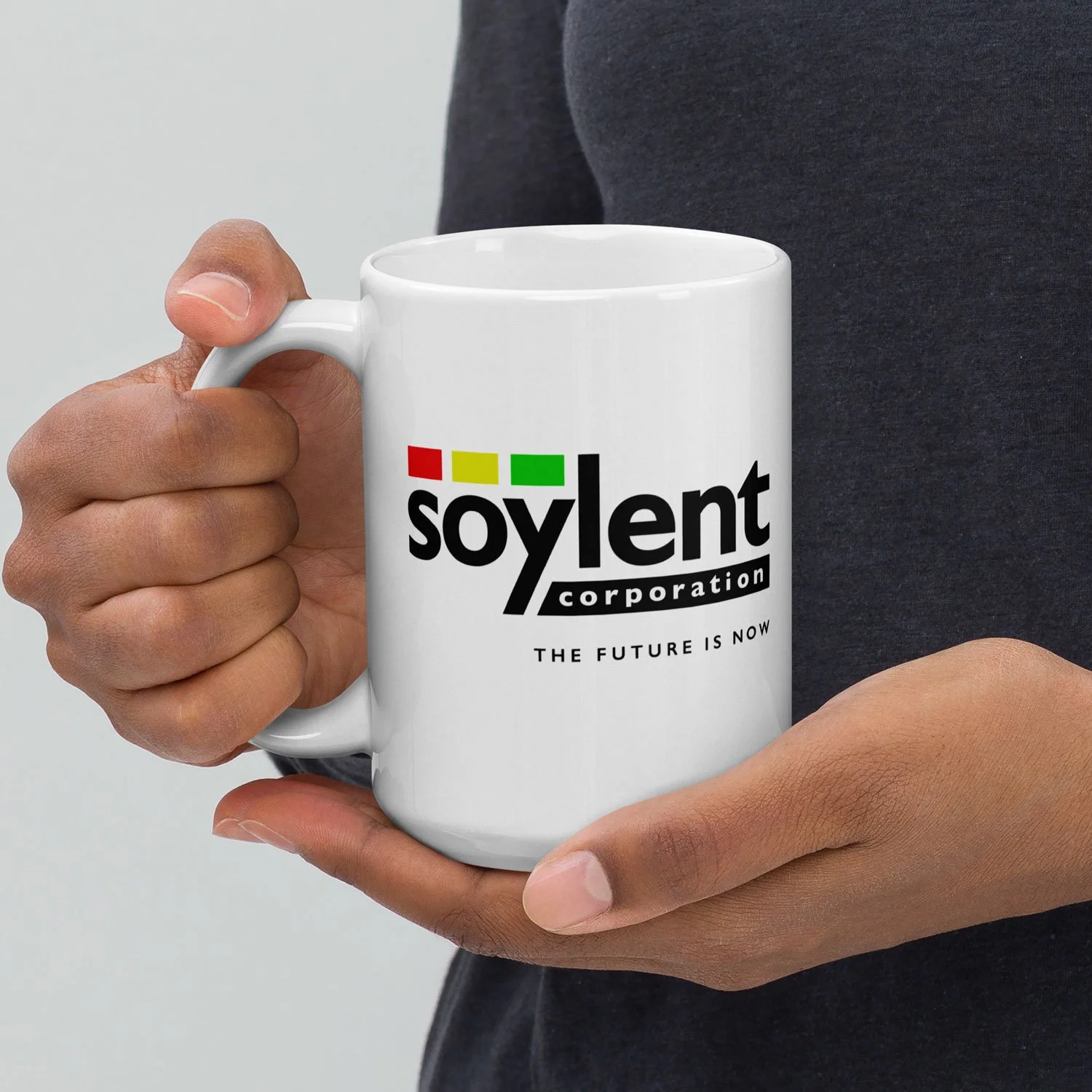 Close-up of a man holding a 15-oz Soylent Corporation Mug.