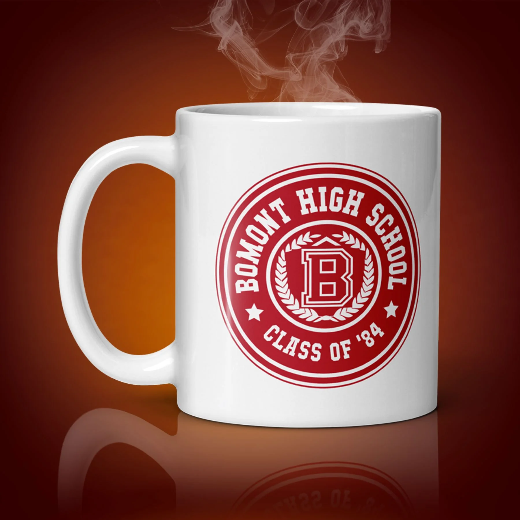 An 11-oz Bomont High School Mug displays the right side. The artwork on our mug is inspired by the movie "Footloose". It is available for $21.99 with free shipping.