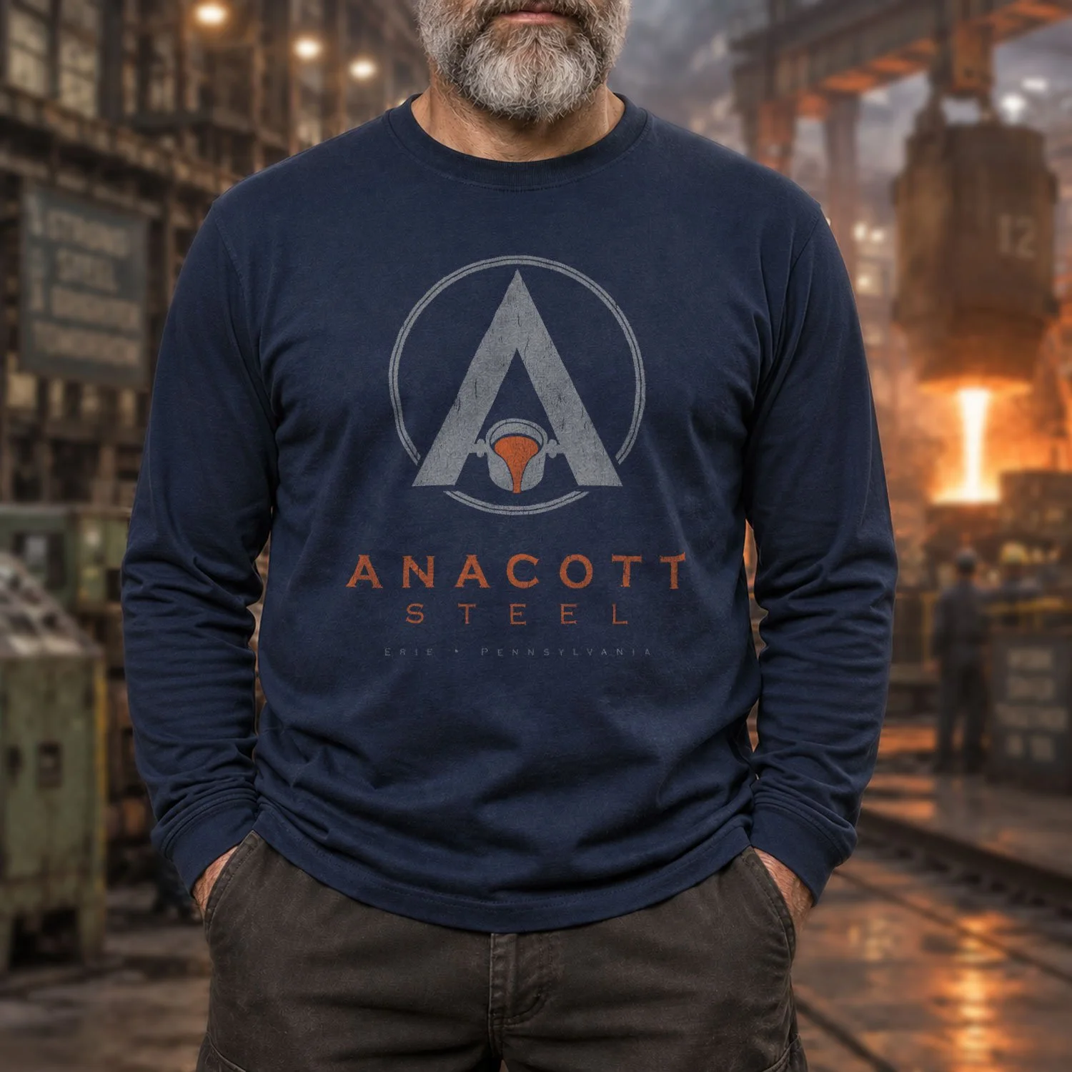 Image of a man wearing an Anacott Steel long sleeve T-shirt inside a steel mill.