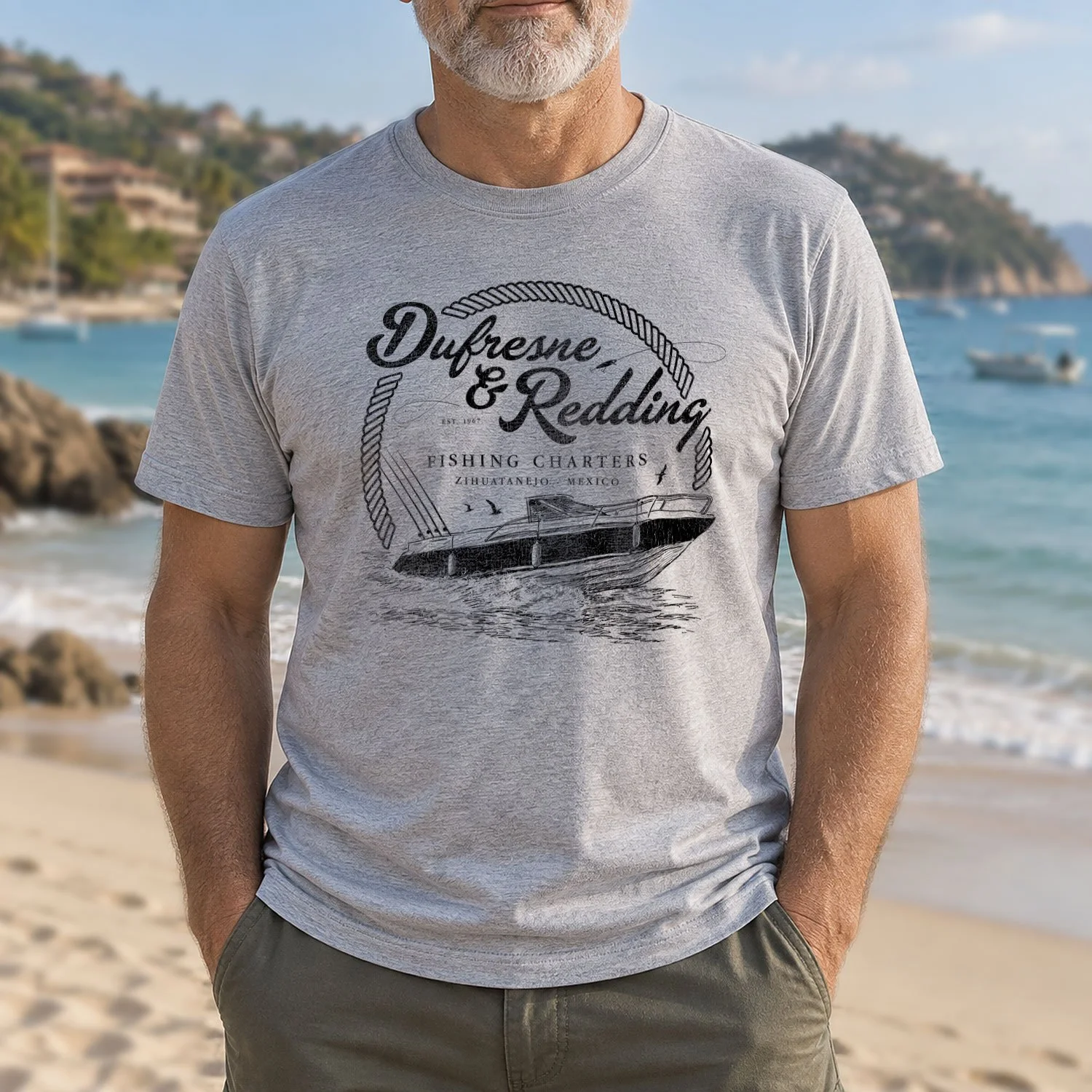 Image of a man wearing a Dufresne & Redding Fishing Charters T-shirt on a beach in Zihuatanejo, Mexico.