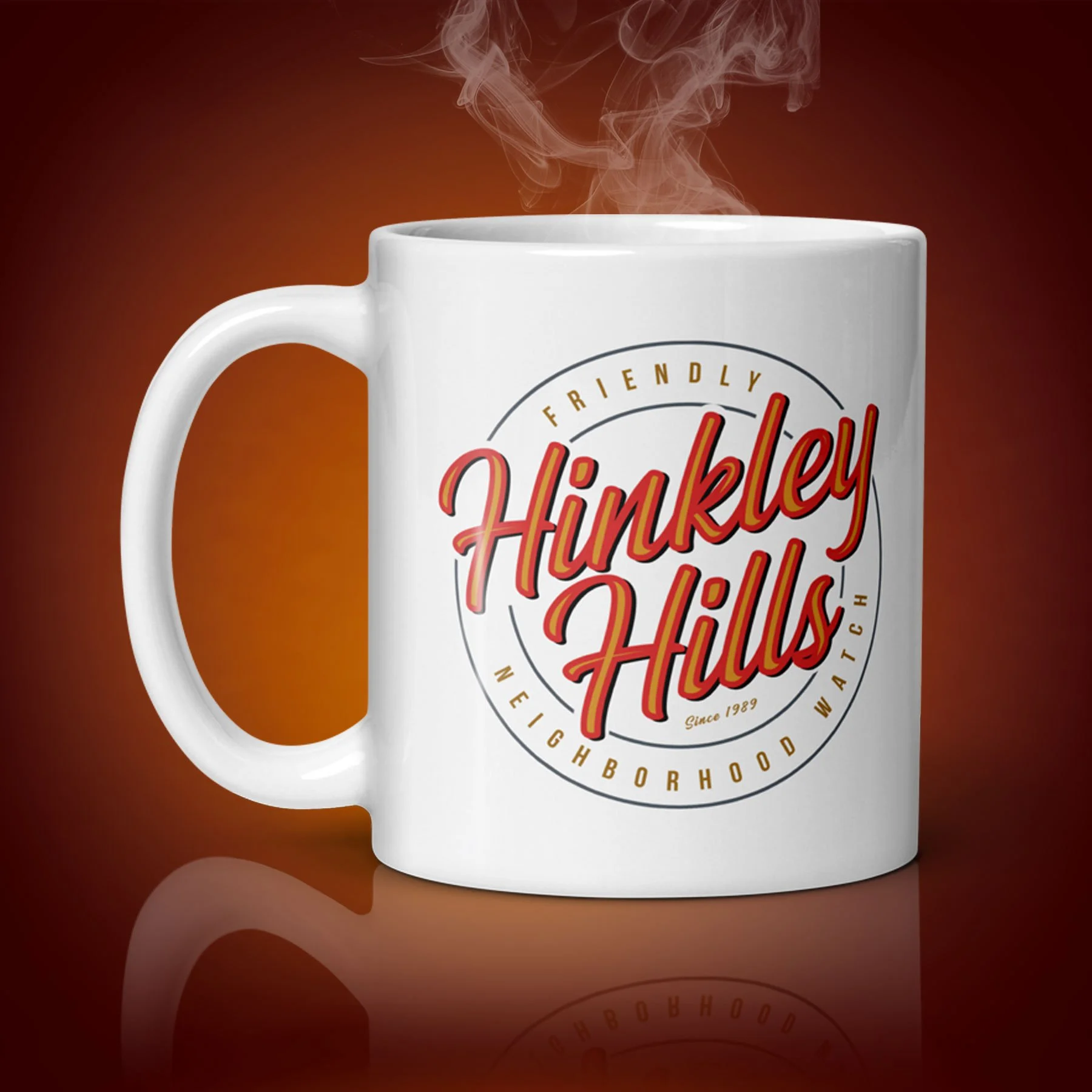 An 11-oz Hinkley Hills mug displays the right side. The artwork on our mug is inspired by the movie "The 'Burbs". It is available for $21.99 with free shipping.