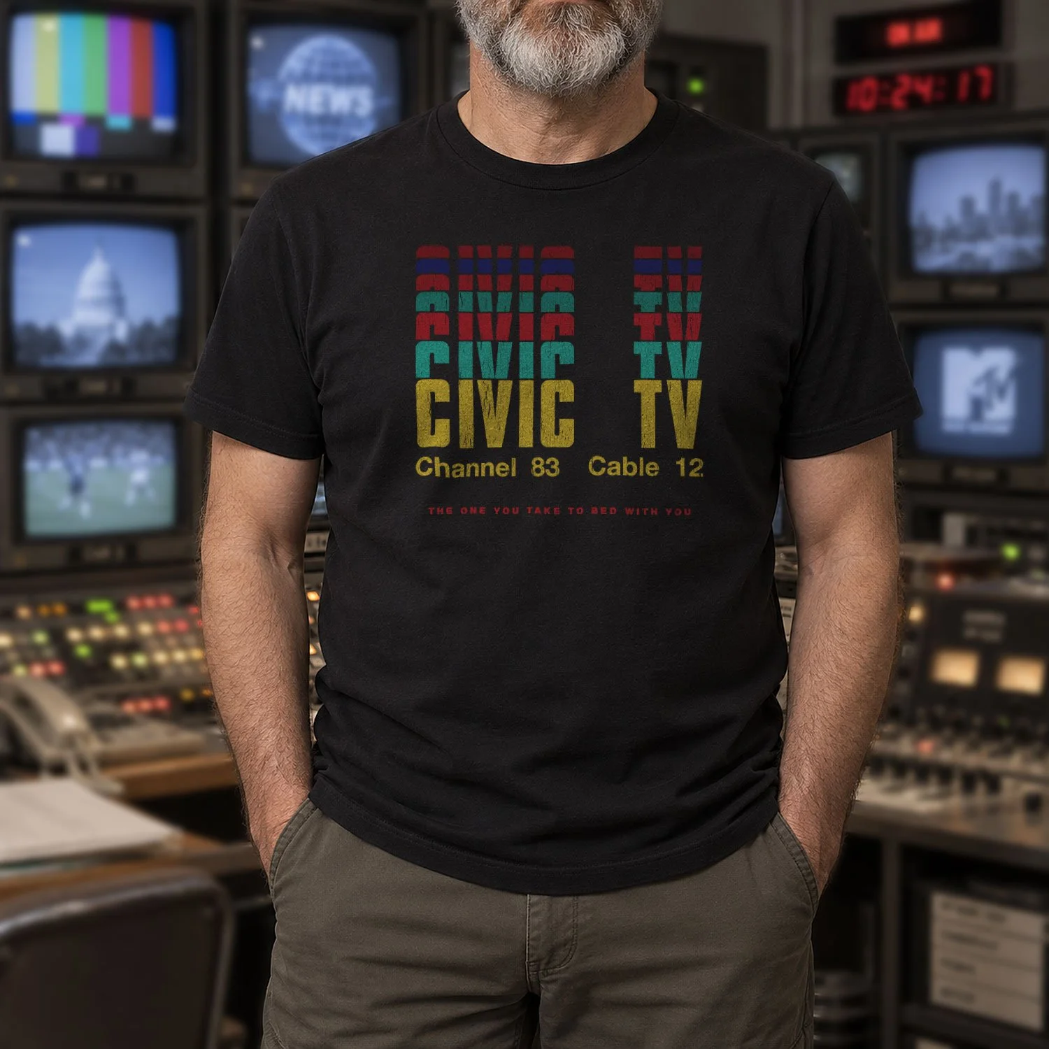 Image of a man in a Civic TV T-shirt inside a classic TV editing room.