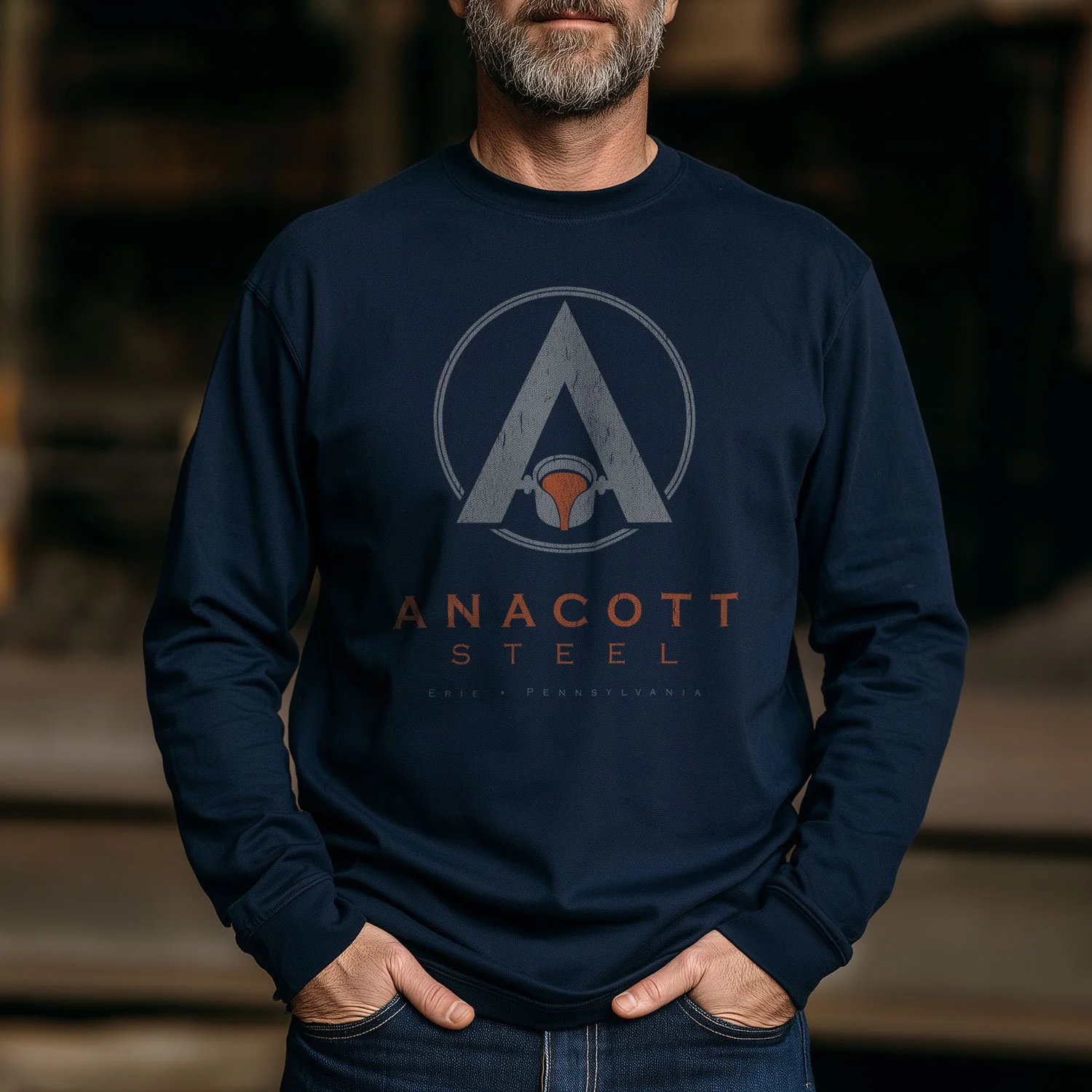 Image of a man wearing an Anacott Steel long sleeve T-shirt inside a steel mill.