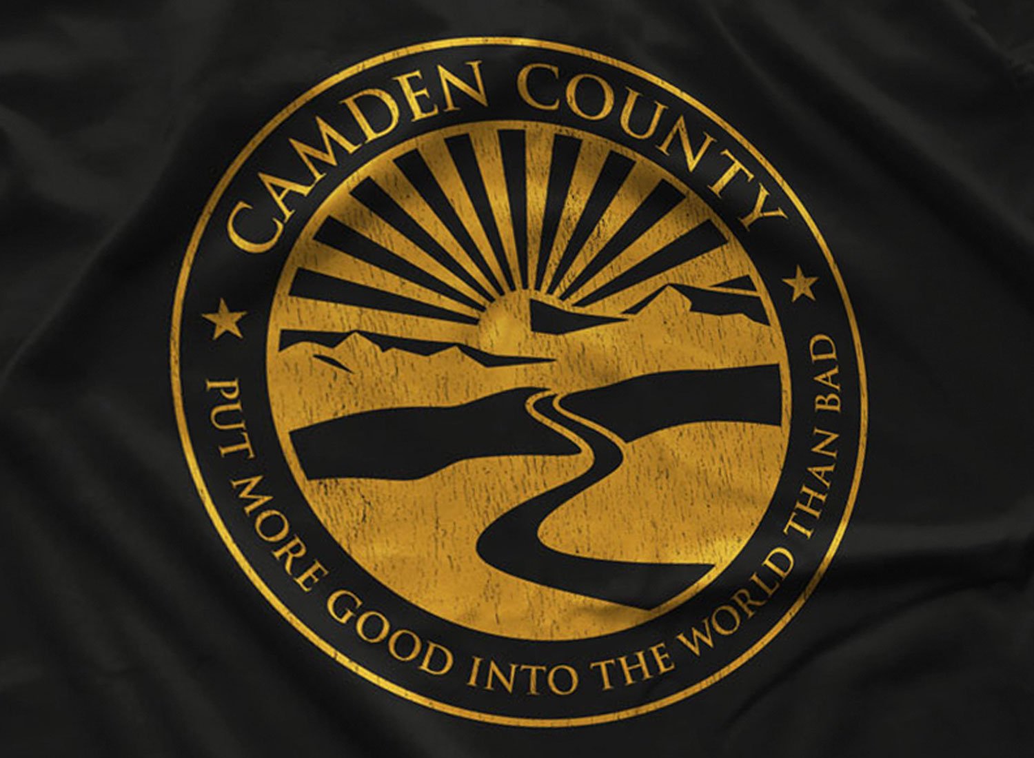 Close-up of a Camden County T-shirt in Black. Get your "My Name Is Earl"-inspired shirt in sizes S to 5XL, starting at just $21.49 with free shipping.