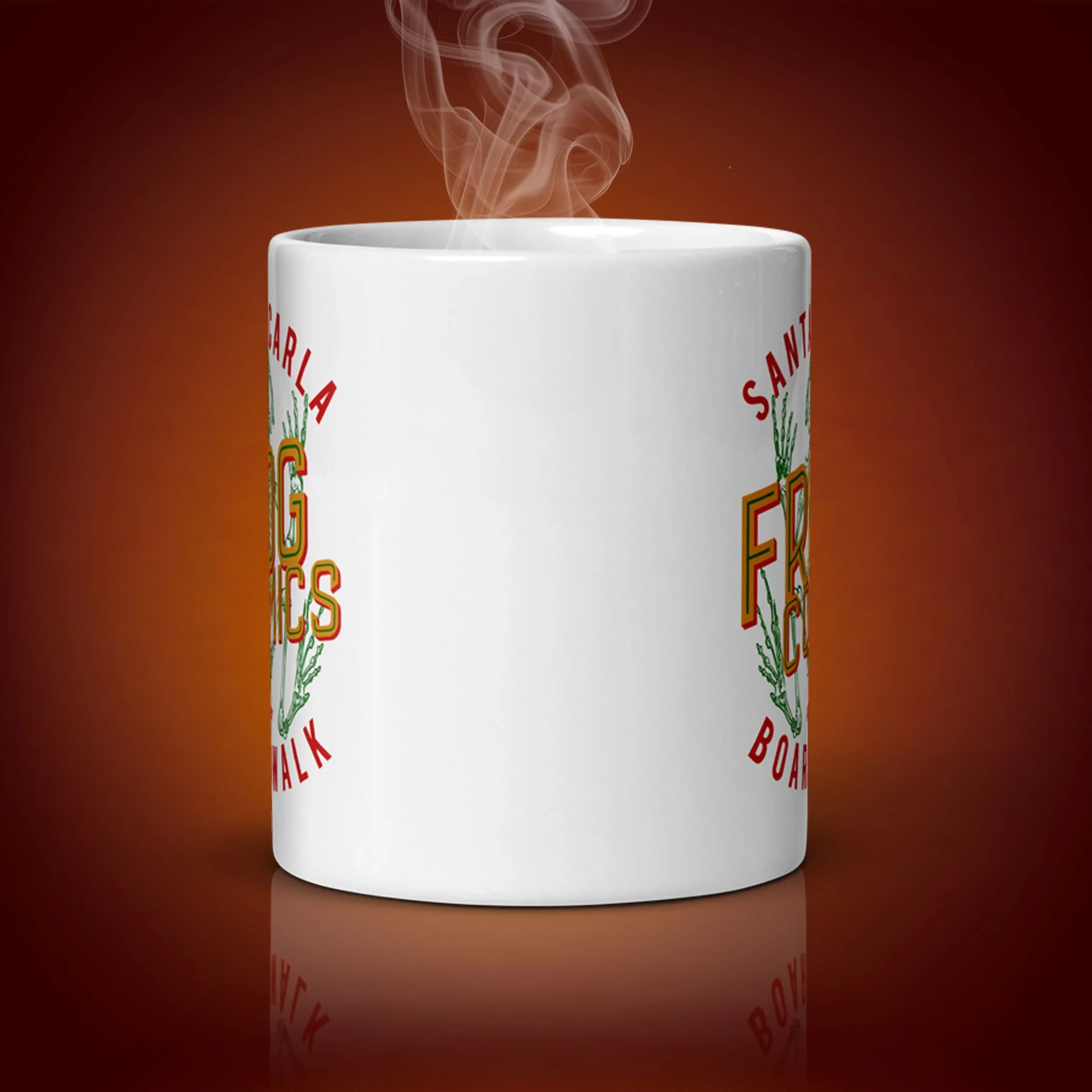 An 11-oz Frog Comics Mug displays the center side. The artwork on our mug is inspired by the movie "The Lost Boys". It is available for $21.99 with free shipping.