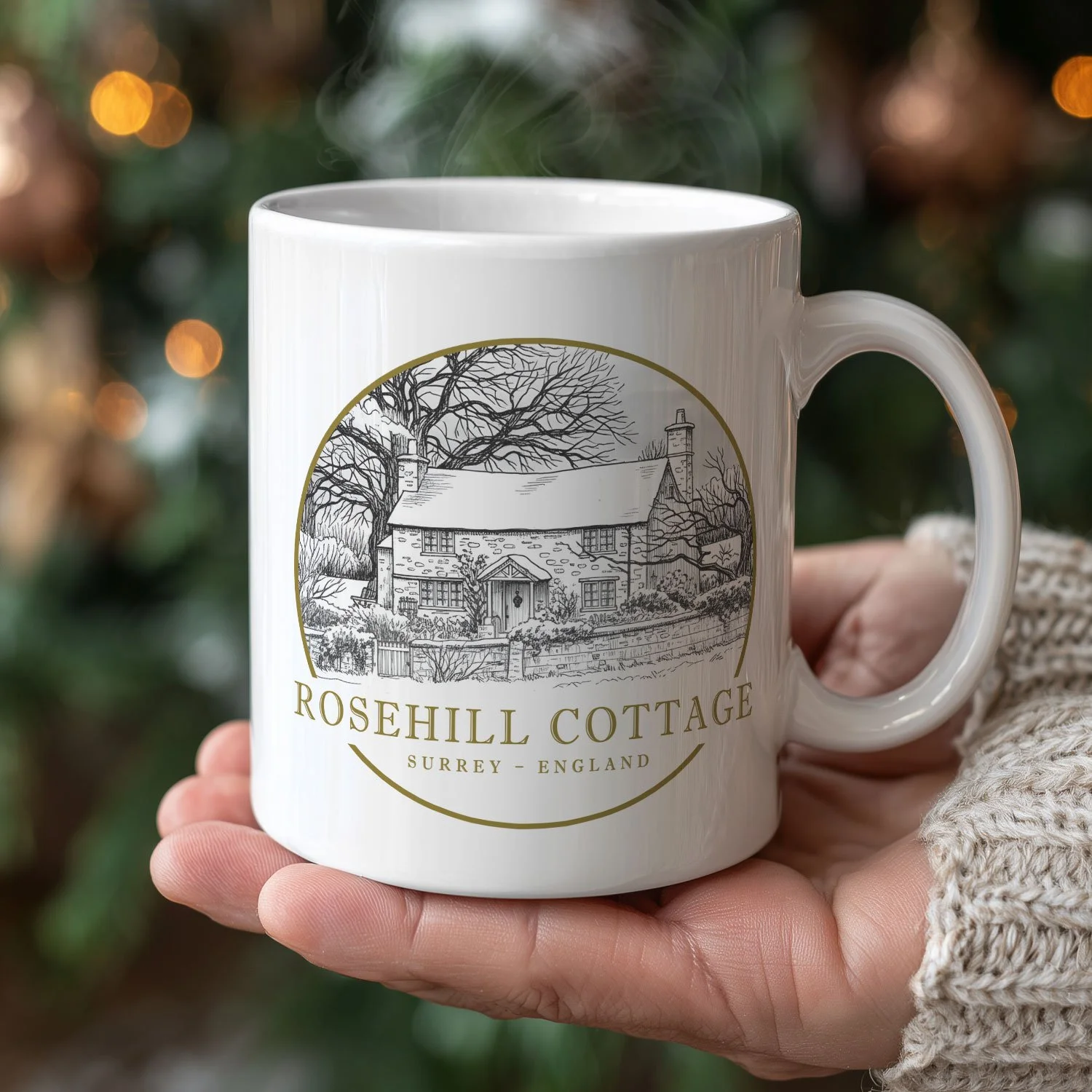 A Rosehill Cottage Mug is shown here in the hand of a woman with a Christmas tree in the background.