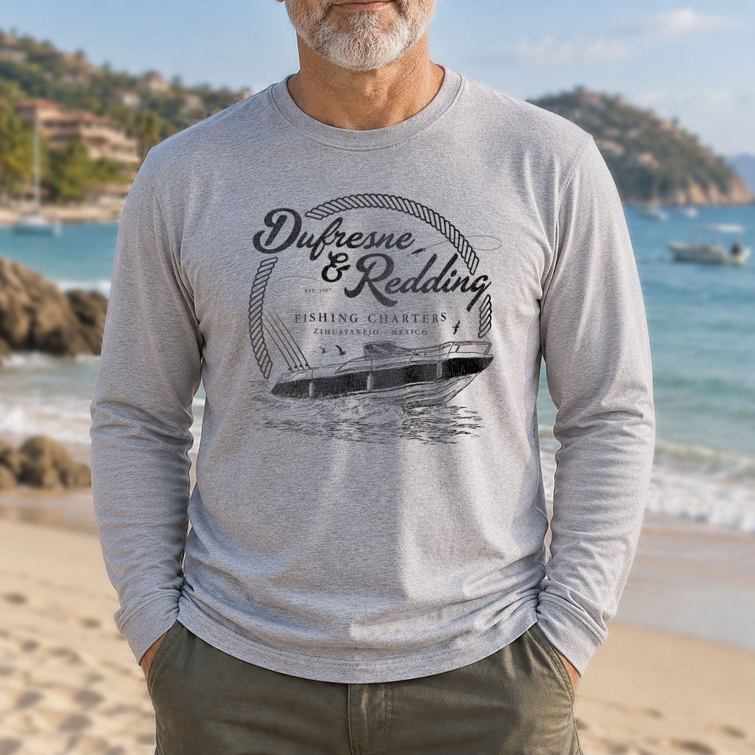 Image of a man wearing a Dufresne & Redding Fishing Charters long-sleeve T-shirt on a beach in Zihuatanejo, Mexico.
