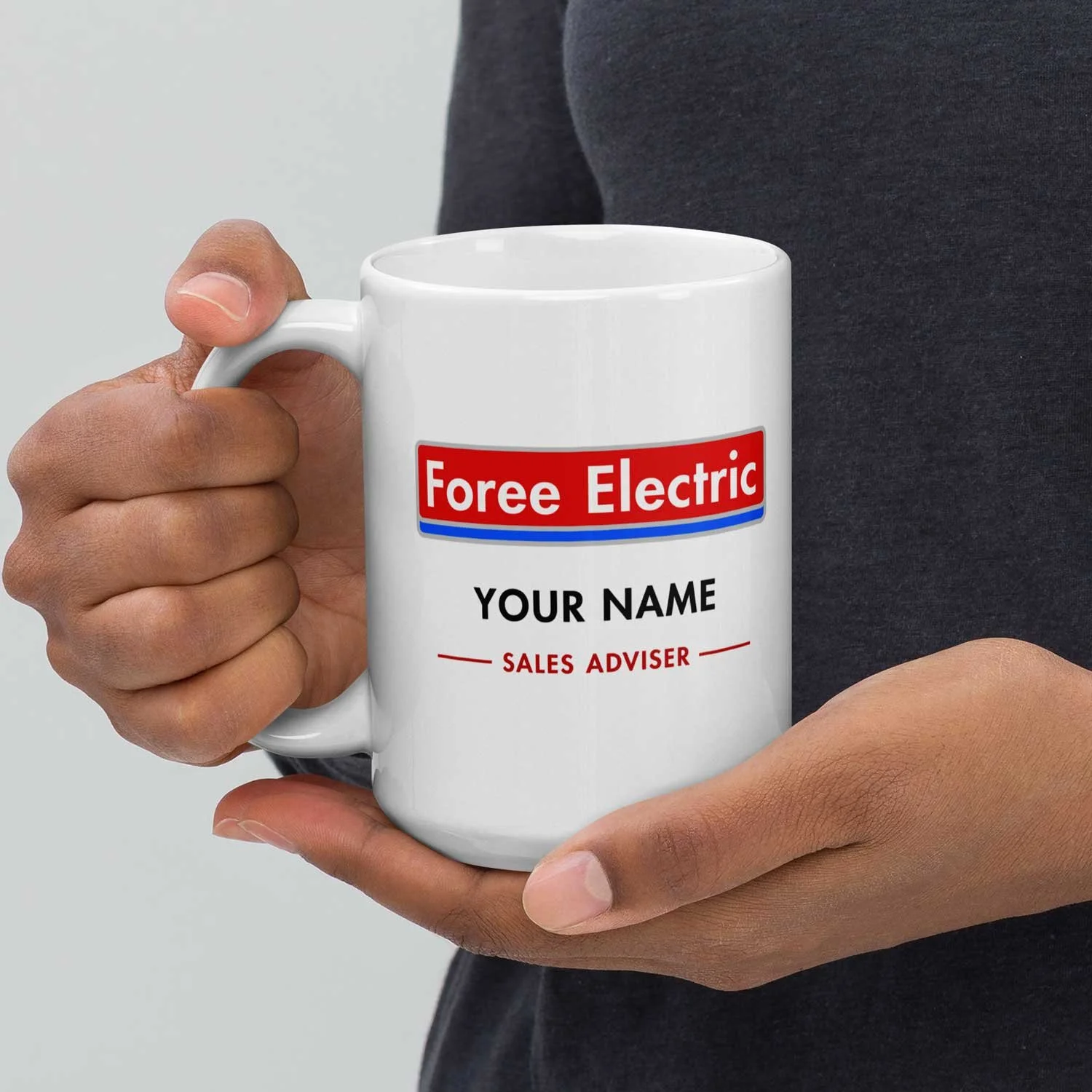 Close-up of a man holding a 15-oz personalized Foree Electric Mug.
