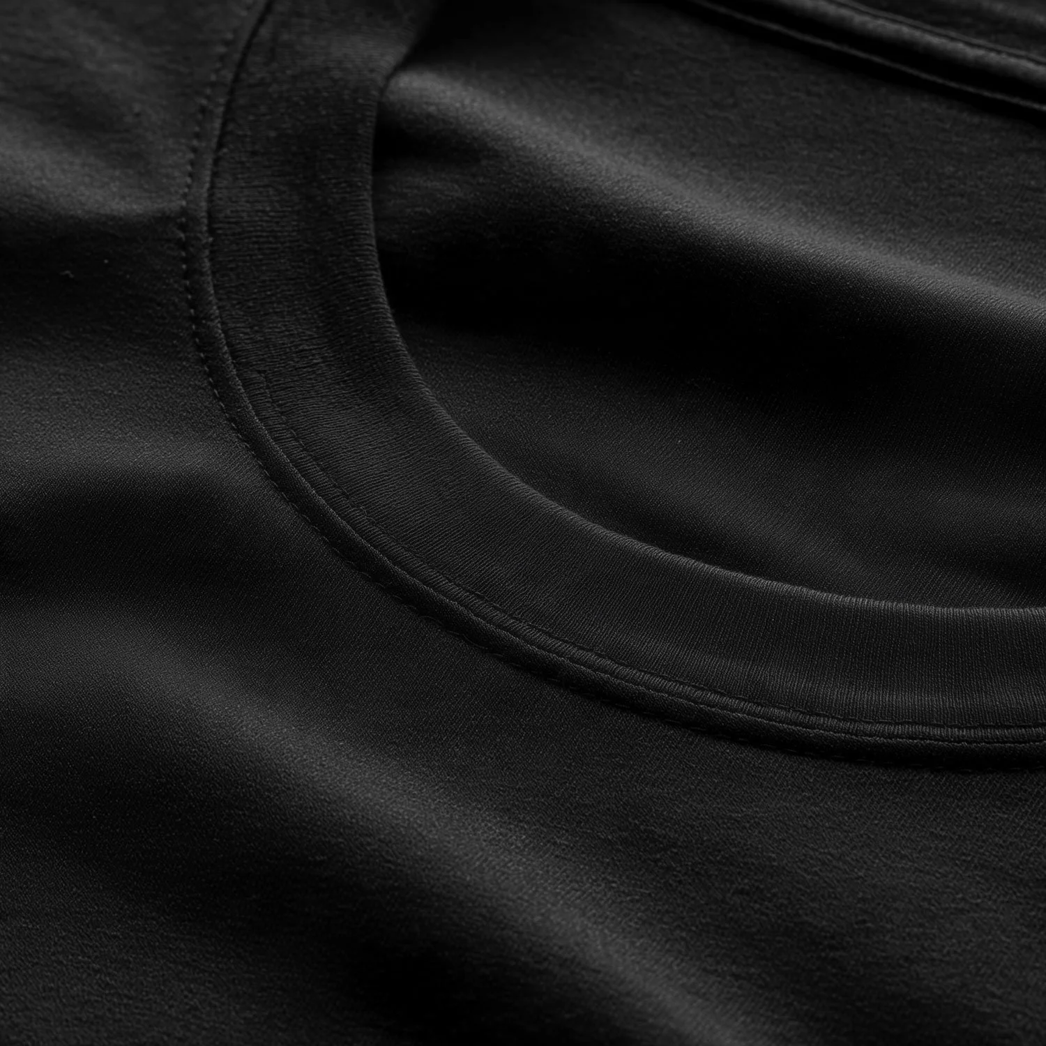 A detailed close-up shot highlighting the structure of the T-shirt's neckline.