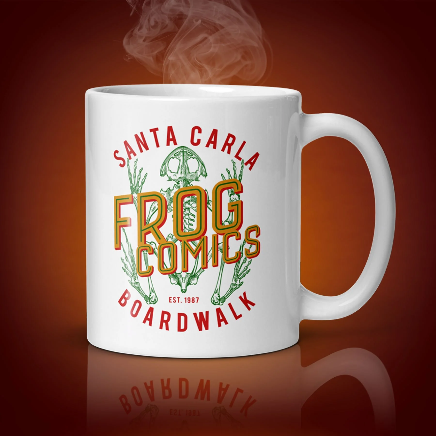 An 11-oz Frog Comics Mug displays the left side. The artwork on our mug is inspired by the movie "The Lost Boys". It is available for $21.99 with free shipping.