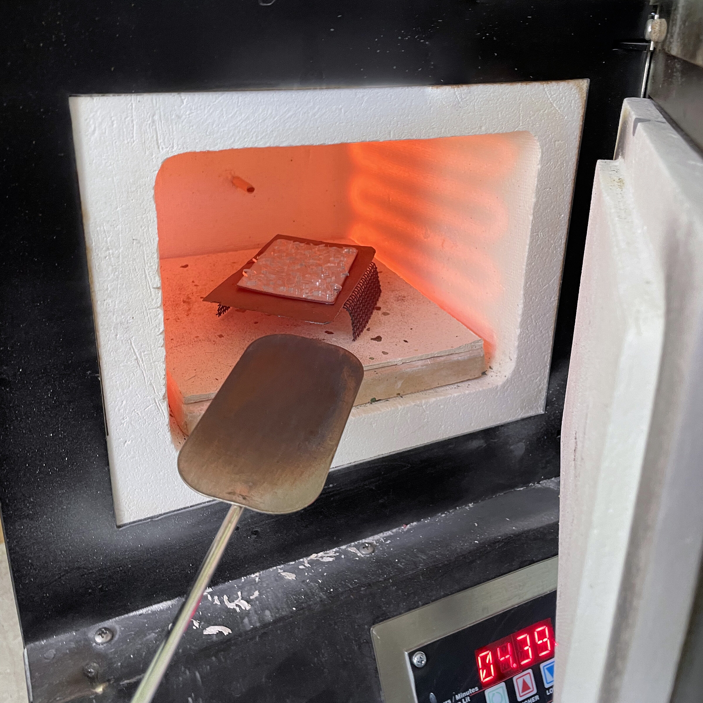  The glass is melted onto the copper in a small kiln at 1450°F. 