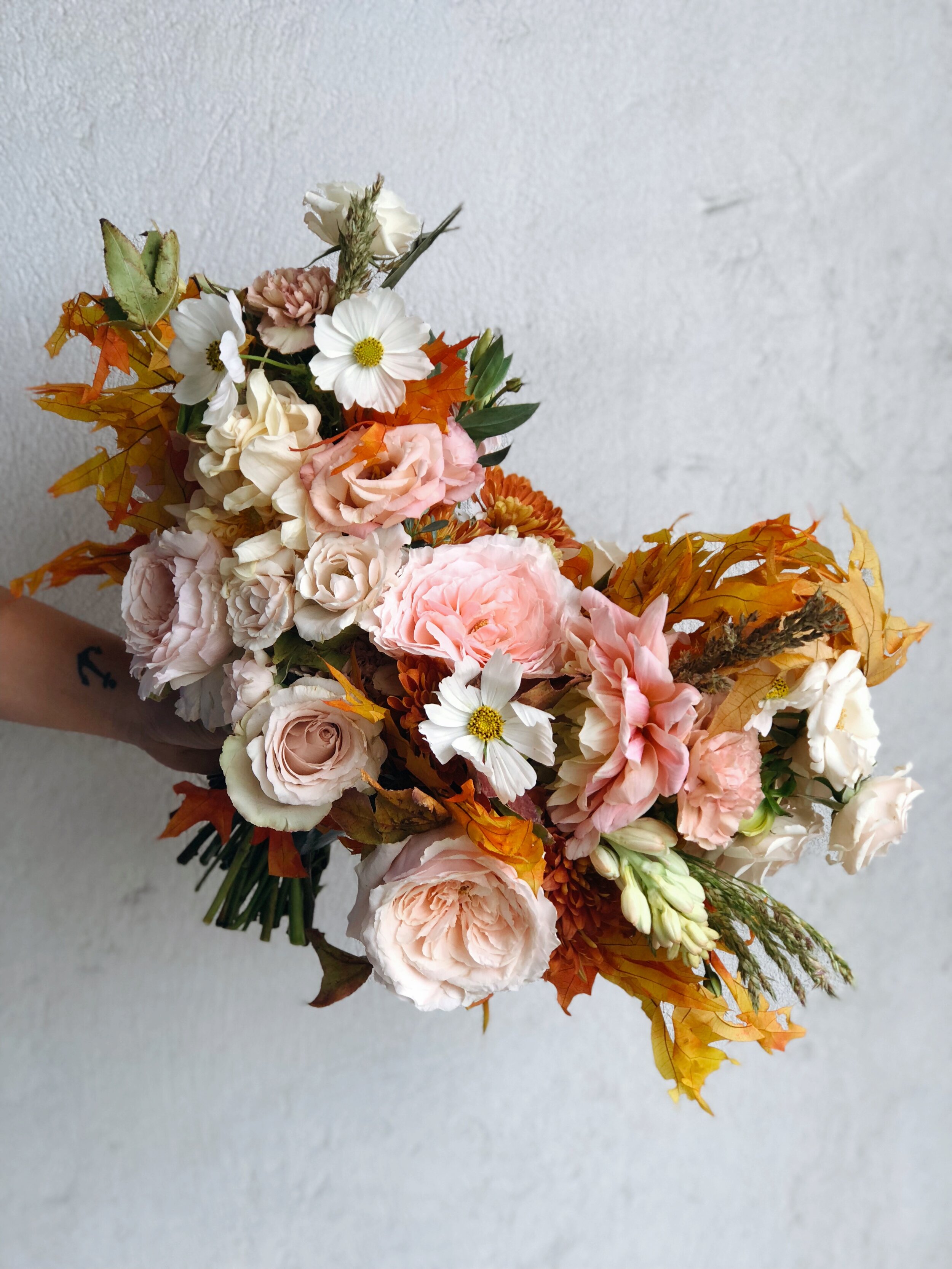 blush and orange bridal bouquet rooted in flora