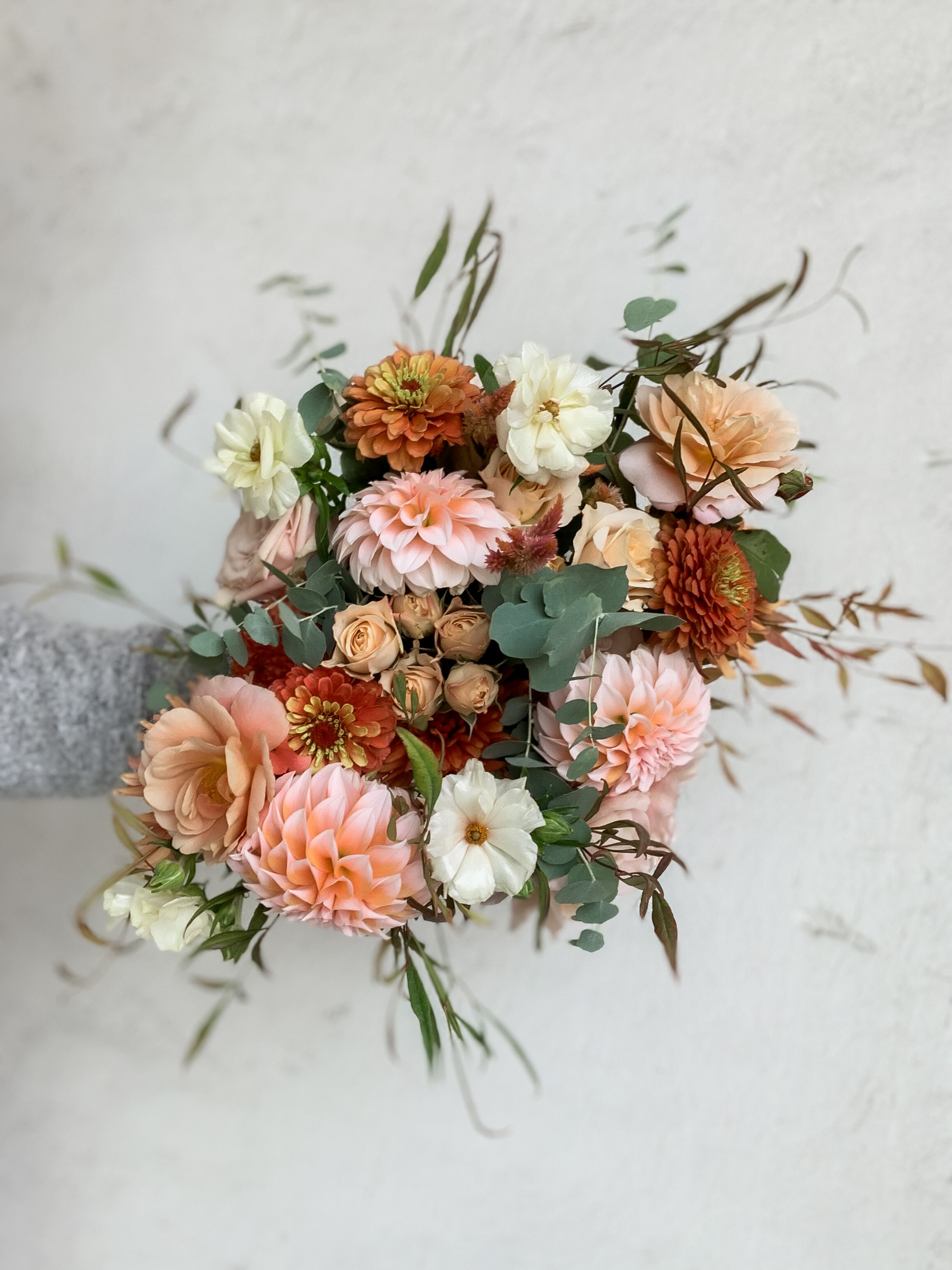 burnt orange, peach, blush bridal bouquet rooted in flora
